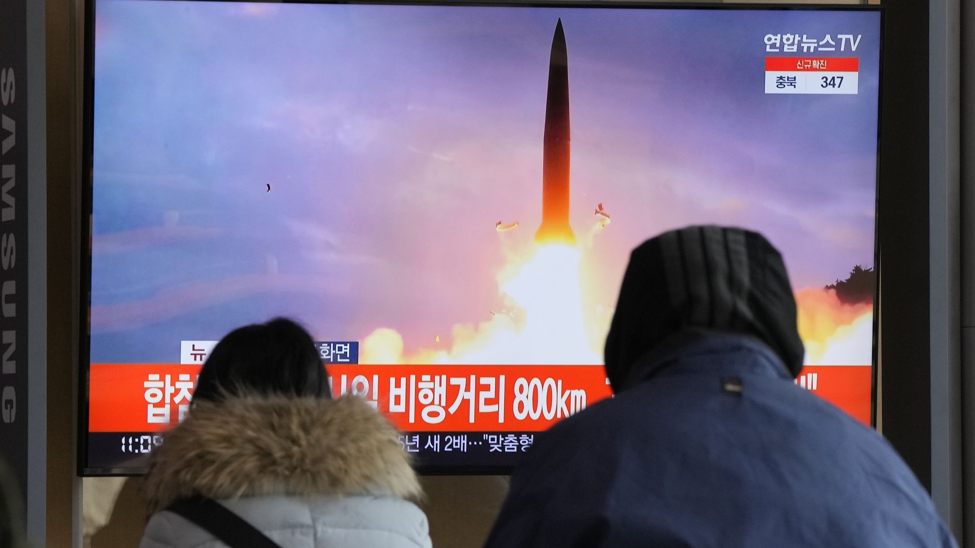 People watch a TV showing a file image of North Korea's missile launch during a news program at the Seoul Railway Station in Seoul, South Korea, Sunday, Jan. 30.