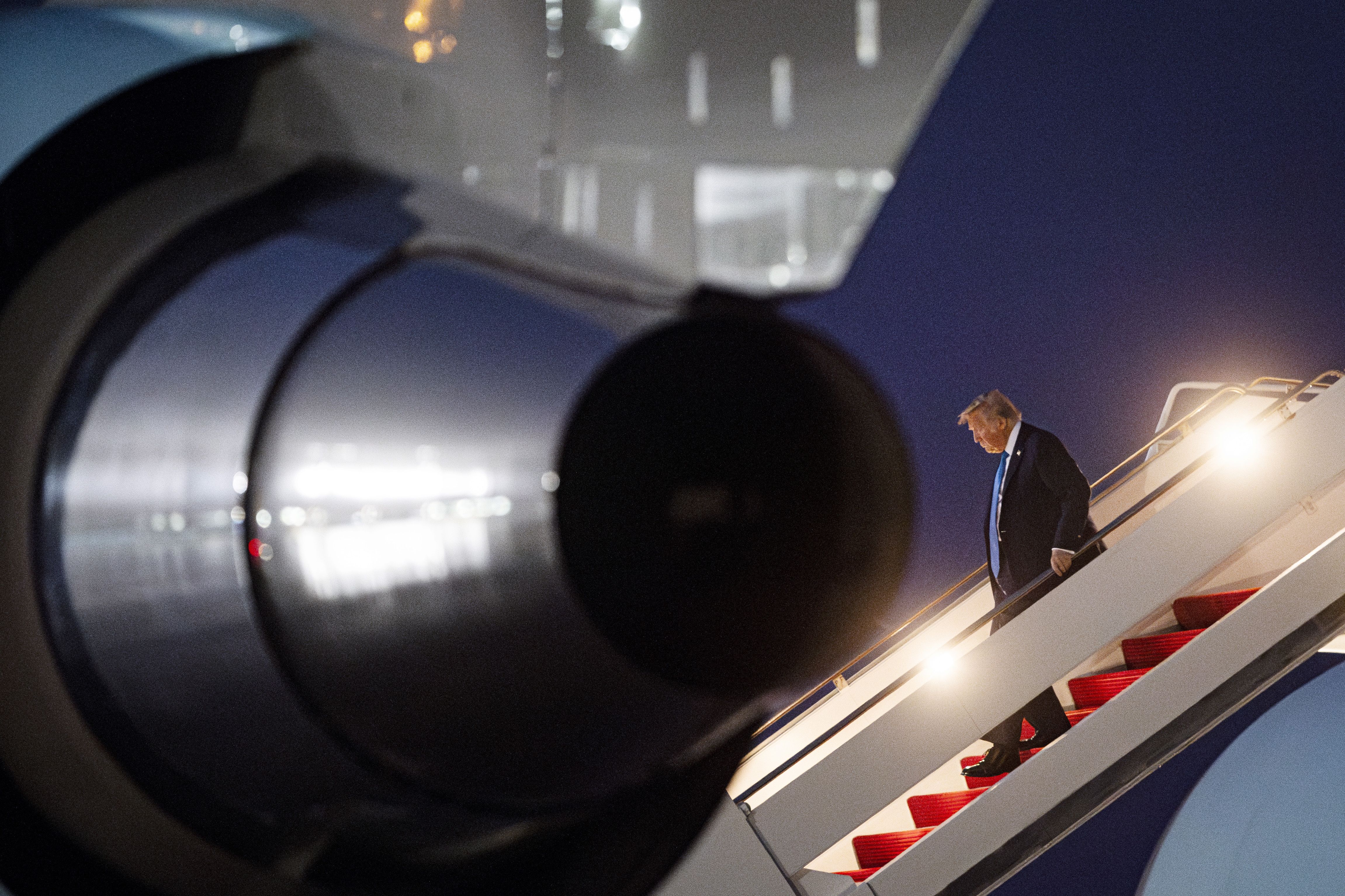 President Trump steps off Air Force One yesterday morning after returning to D.C. early from the G7 summit in Canada.