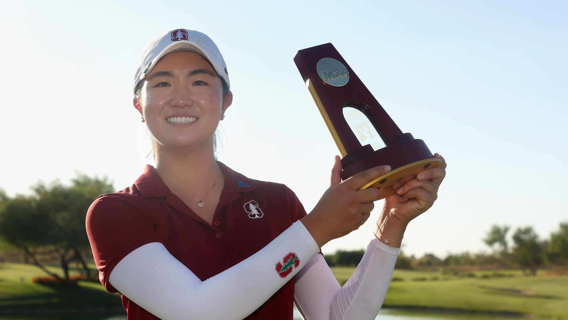 rose zhang holds up trophy
