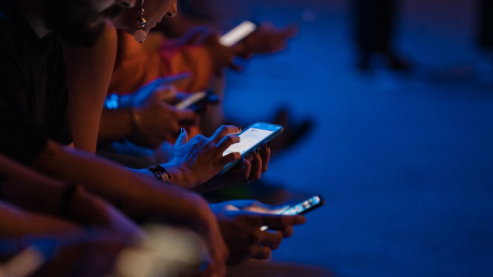 A bunch of people scrolling through their Insta feed.
