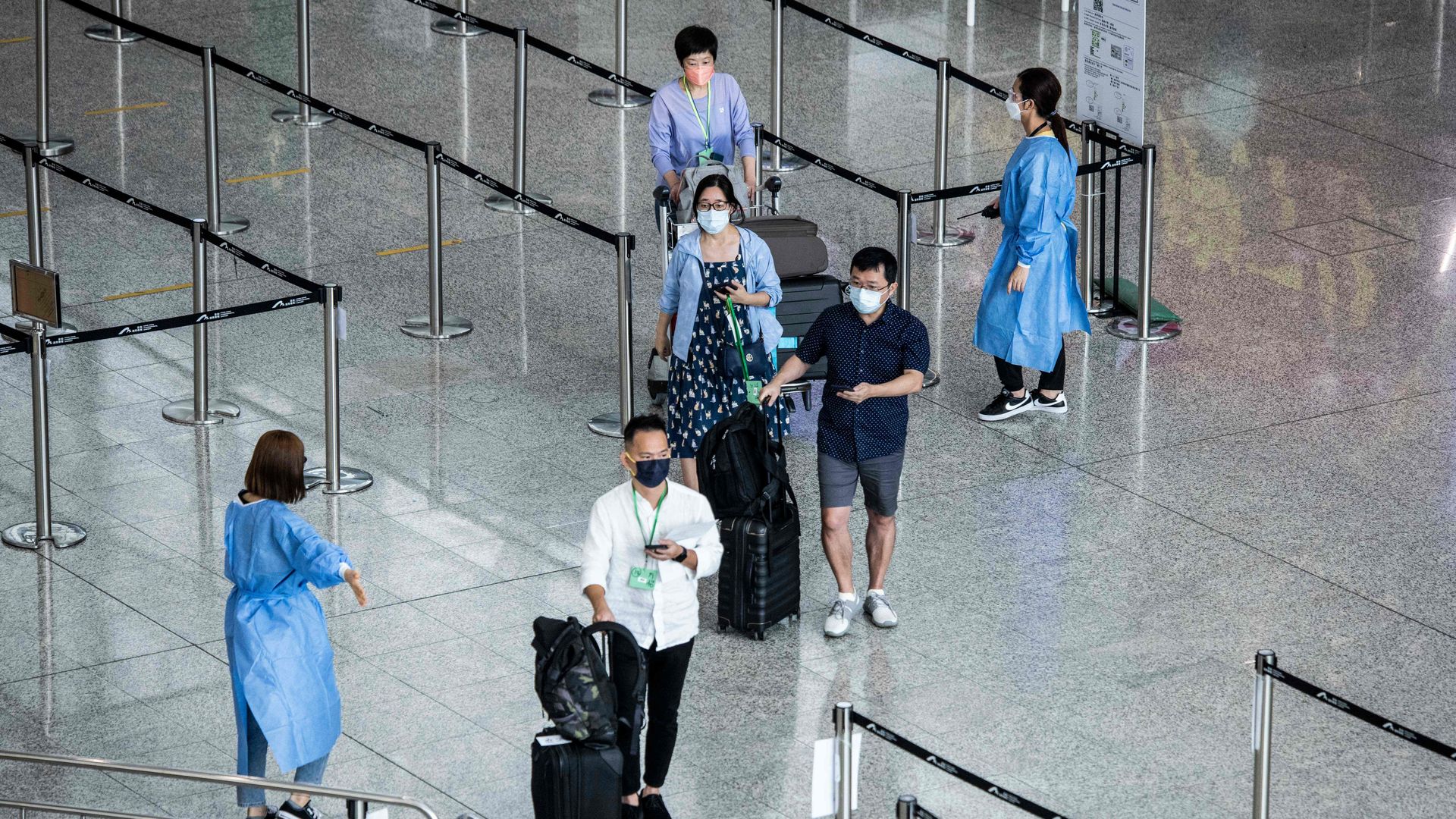 Travelers arrive at Hong Kong International Airport
