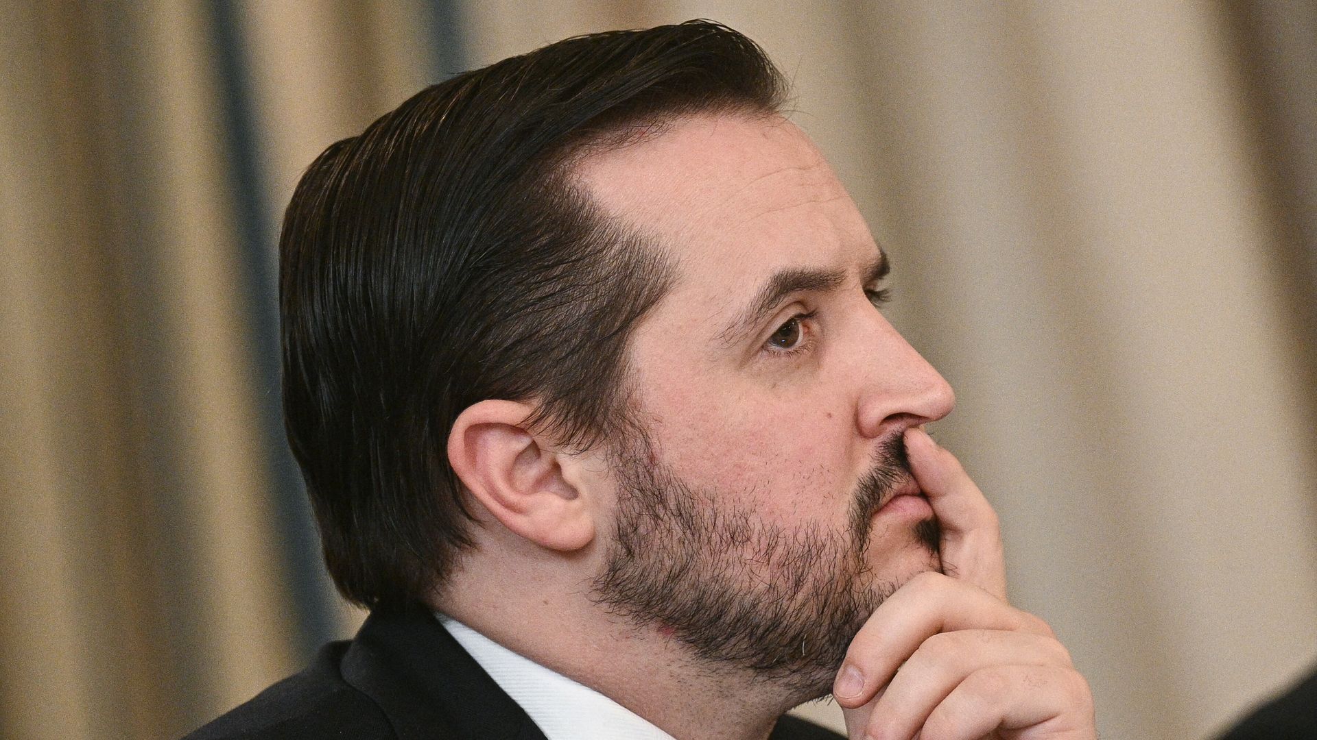 White House Deputy Chief of Staff Taylor Budowich with his finger across his lips.