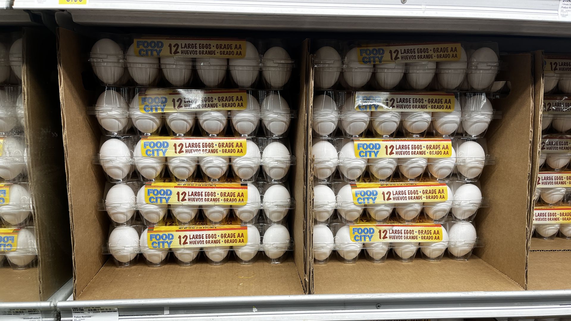 A stack of egg cartons with a $6.49 price tag. 