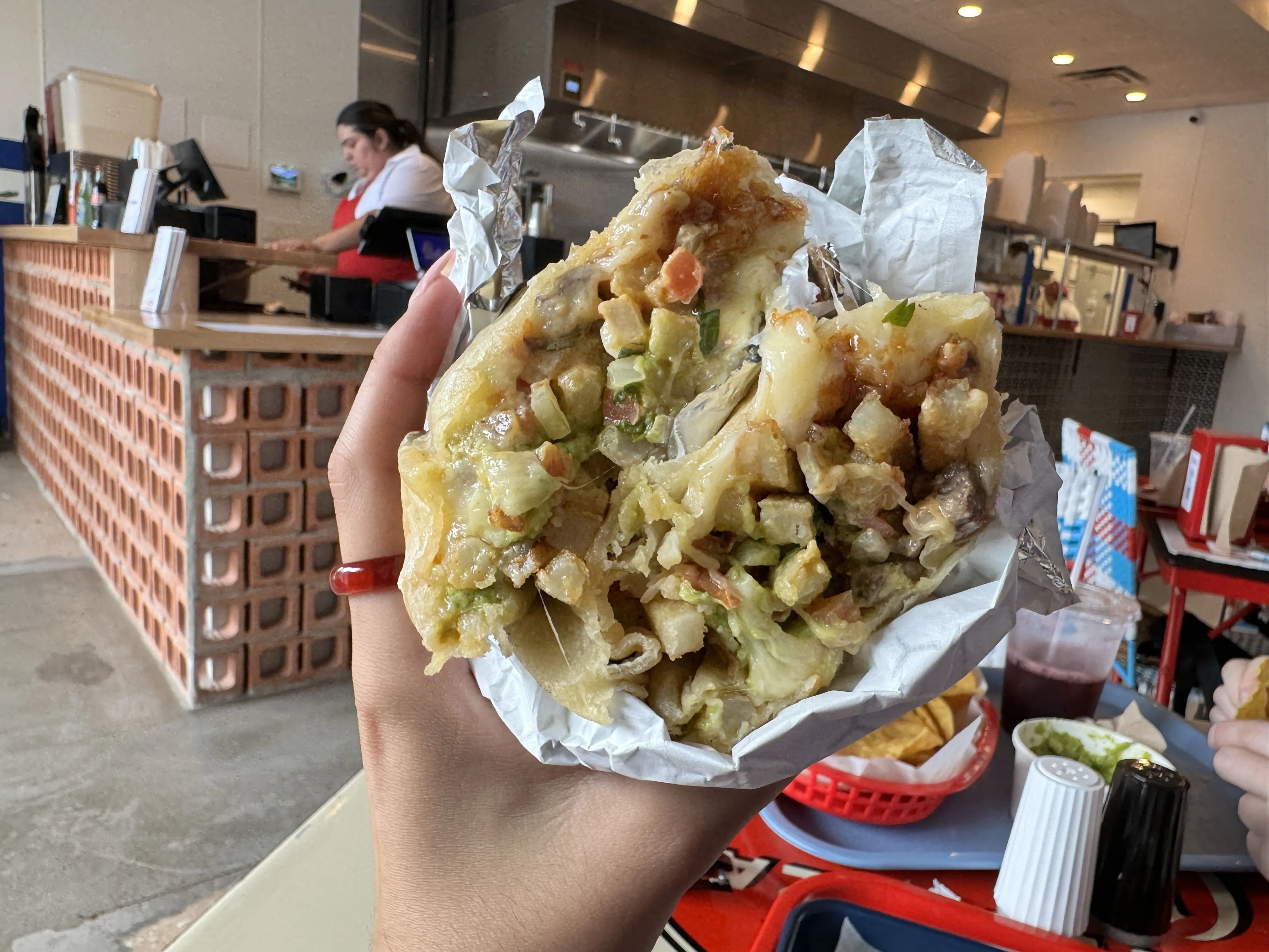 hand holding burrito