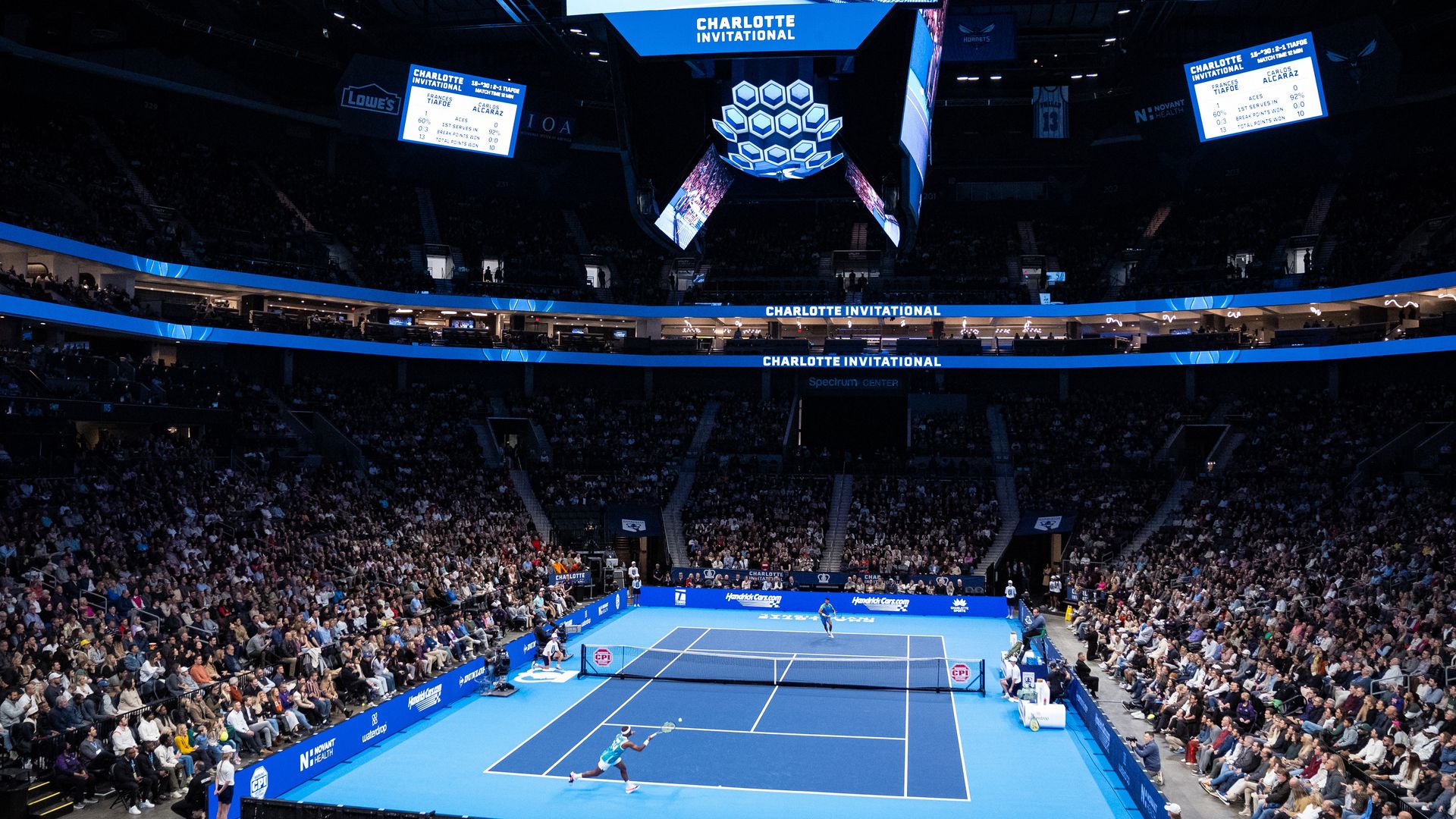 Frances Tiafoe returns against Carlos Alcaraz during the Charlotte Invitational at Spectrum Center on December 06, 2024 in Charlotte, North Carolina. (Photo by Jacob Kupferman/Getty Images)