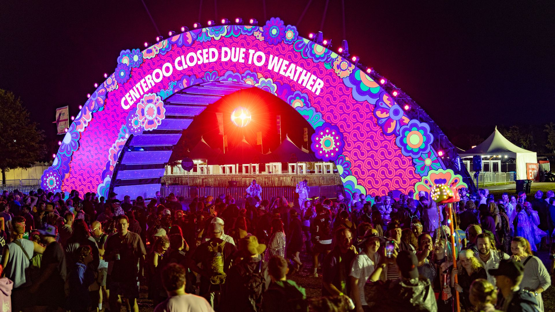 Disappointed fans seen at the Bonnaroo Arch after the Bonnaroo Music and Arts Festival 2025 is canceled due to rain on June 13, 2025 in Manchester, Tennessee.