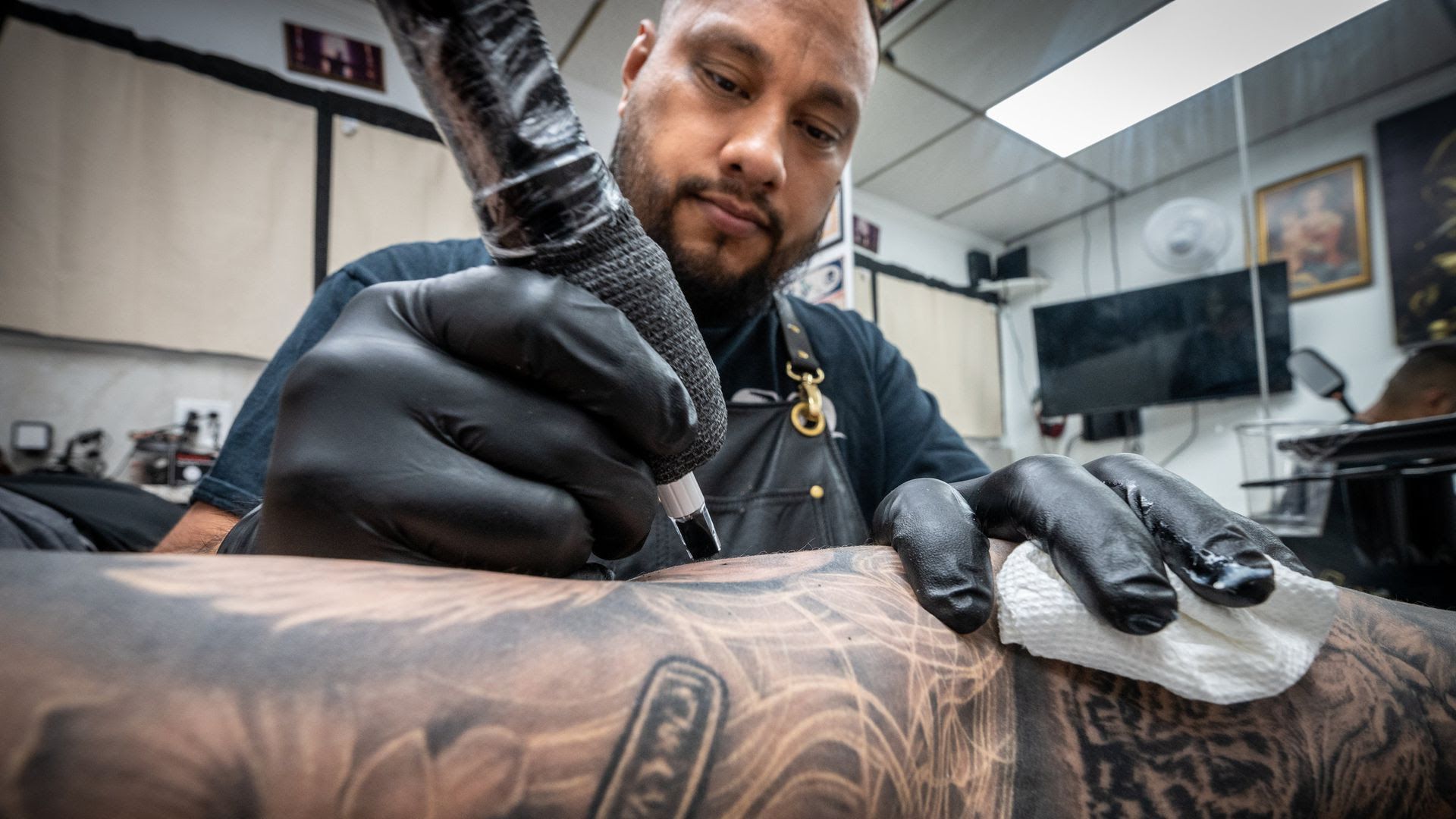 Tattoo artist Andy “Kedavra” Rodrigues in the studio he co-owns, Chupacabra Tattoo in New York. Photo: J. Conrad Williams, Jr./Newsday RM via Getty Images
