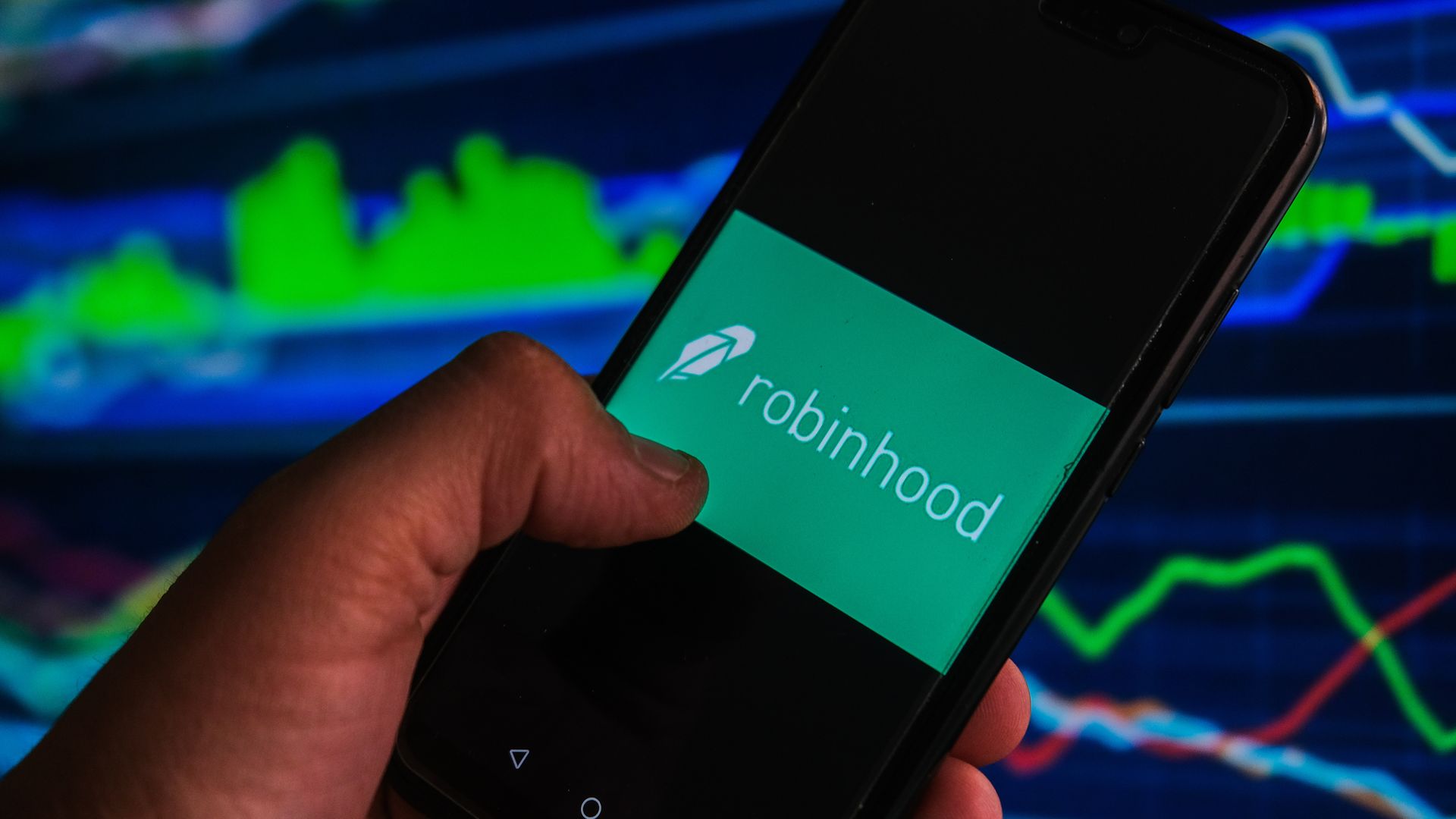 Picture of a hand holding a phone with the Robinhood logo displayed on the screen
