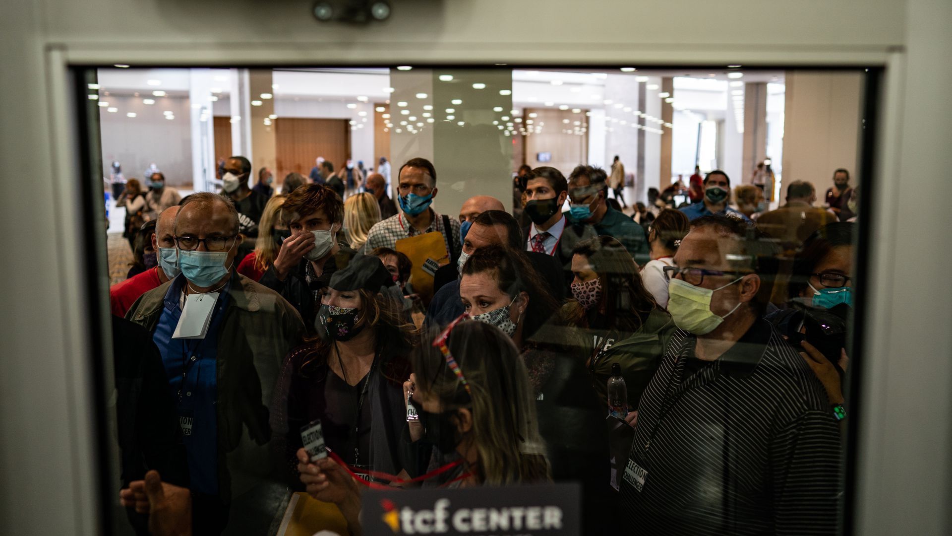 Photo of a crowd of protesters demanding entry to a ballot-counting room in Detroit.