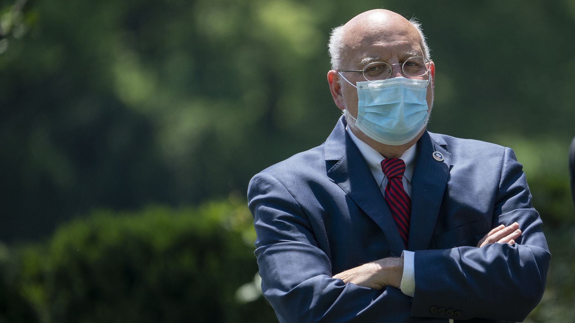 In this image, CDC Director Robert Redfield wears a face mask