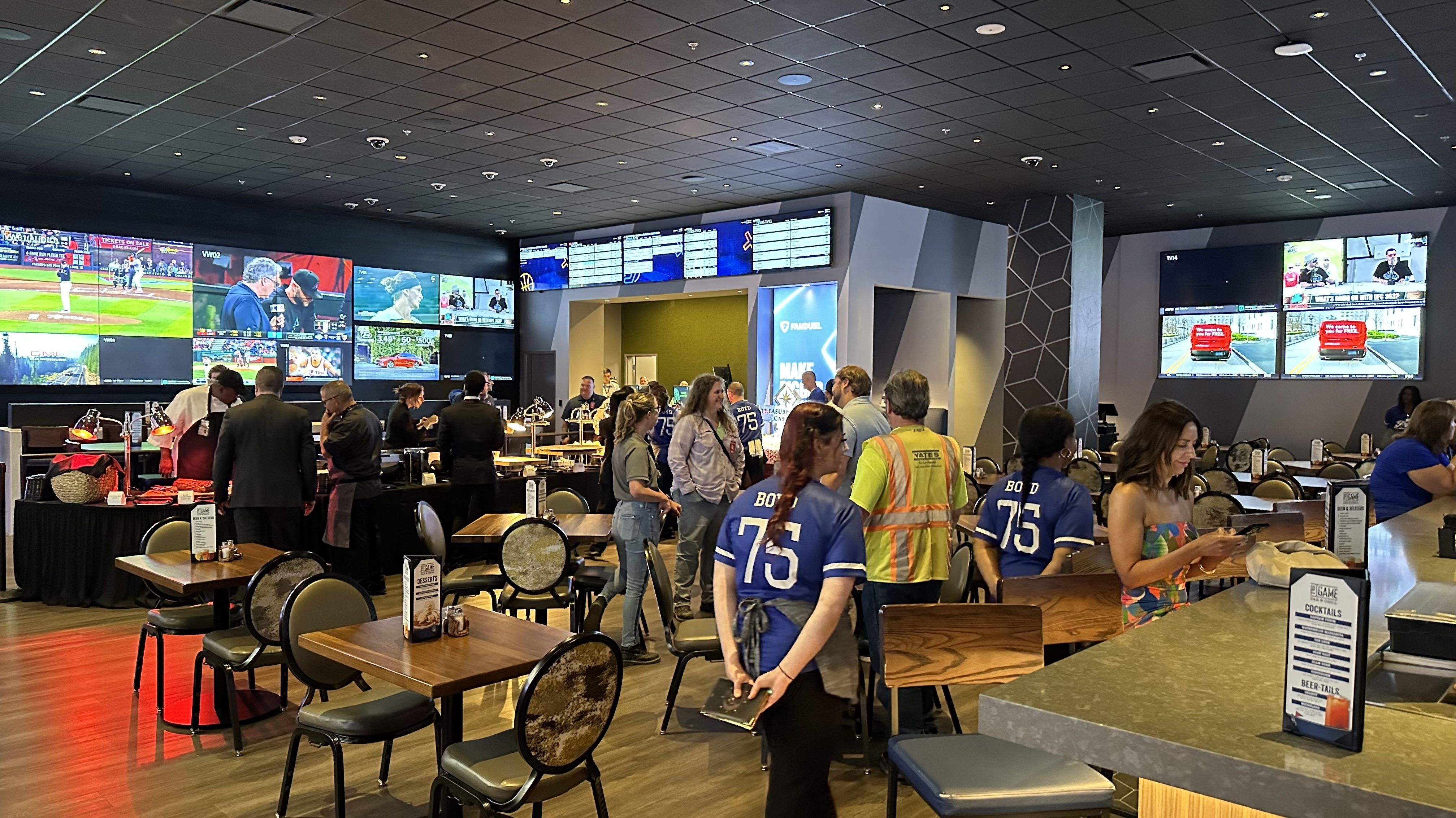 Photo shows a sports bar in the Treasure Chest Casino.