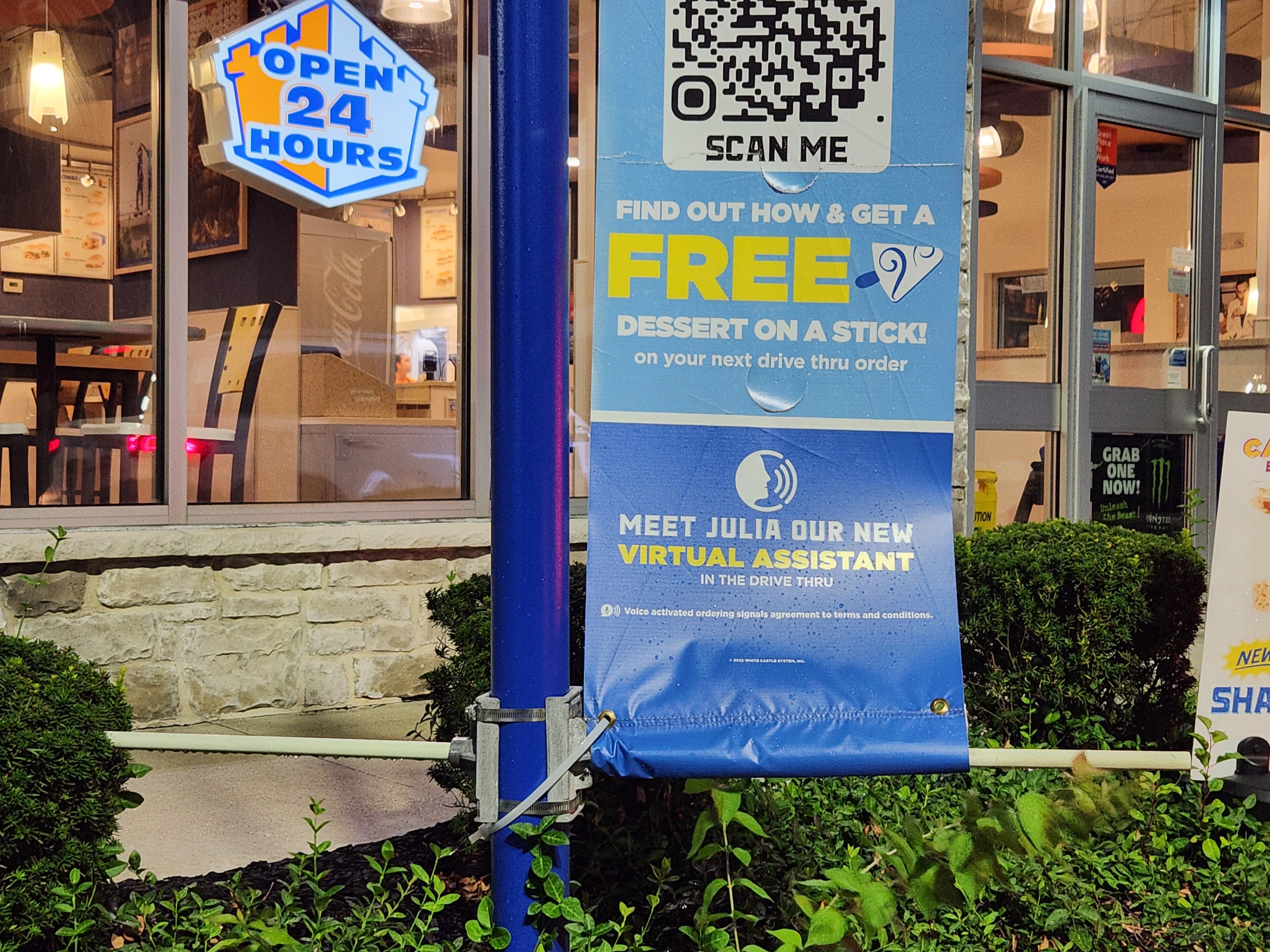A White Castle drive-thru sign reading "Meet Julia Our New Virtual Assistant."