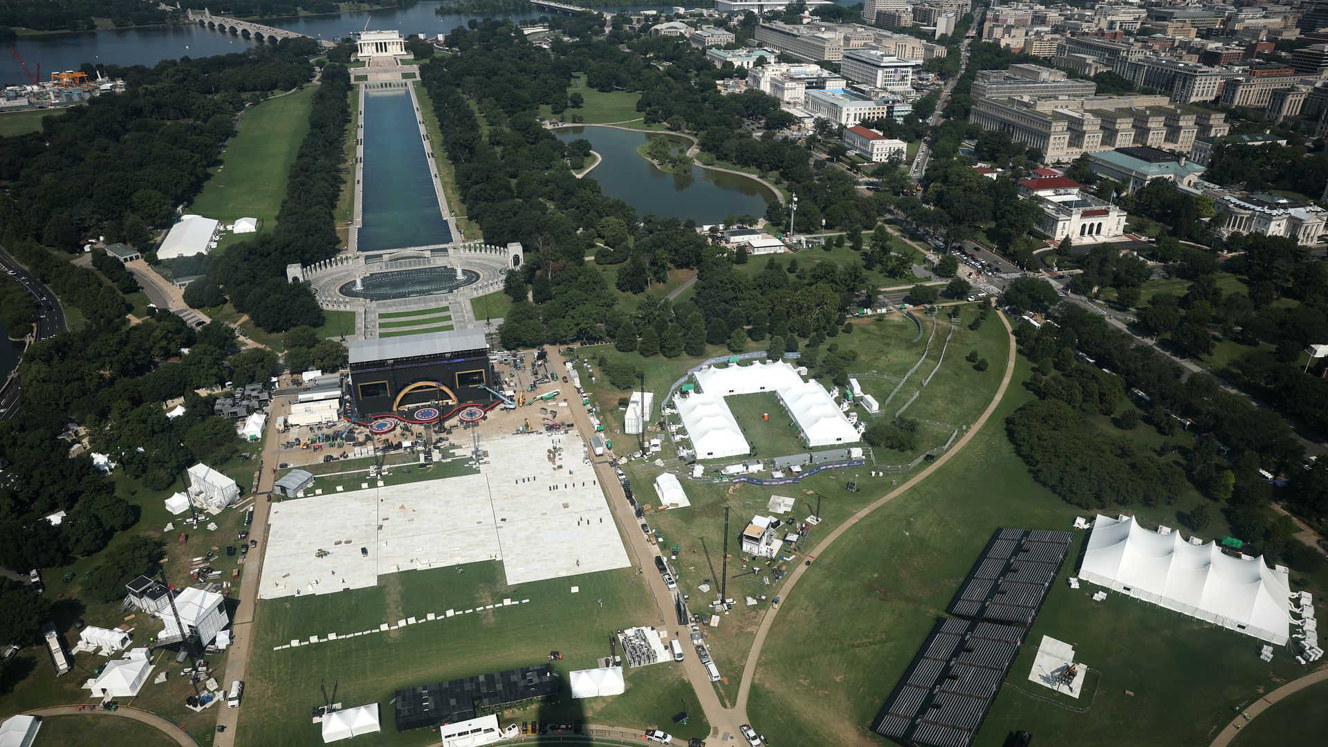 An aerial view of construction of a stage and venue near the Washington Monument for the July 4 fireworks show
