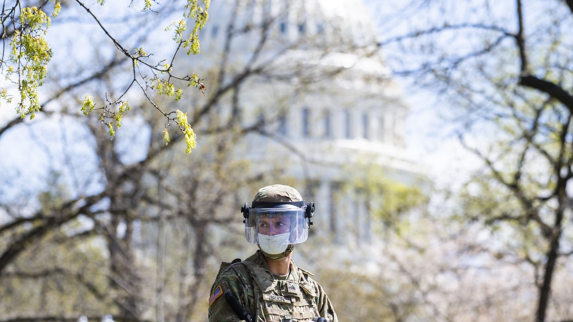 U.S. National Guardsmen stand guard near the Capitol building