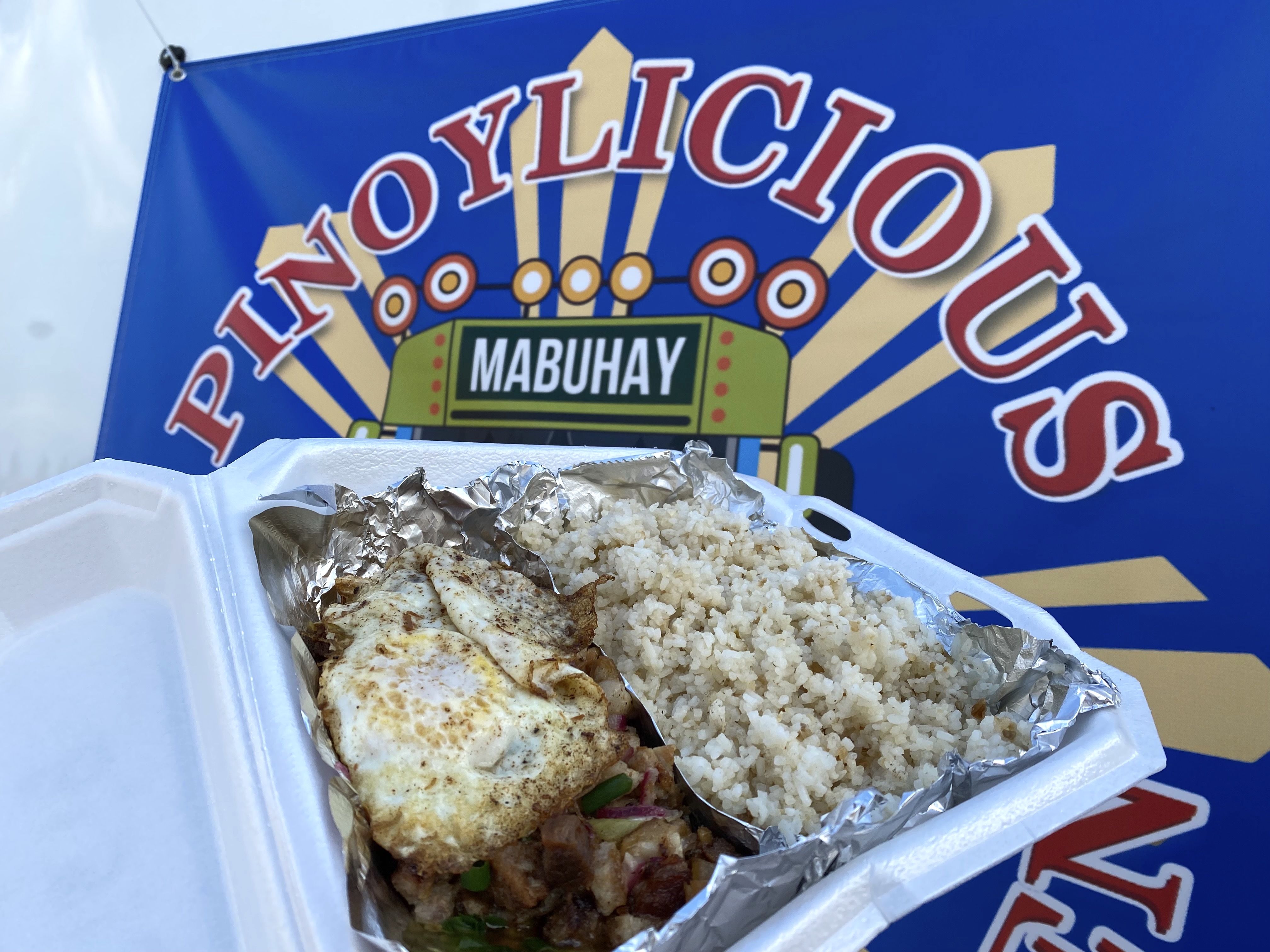 A Filipino dish called Sisig in a to-go container. 