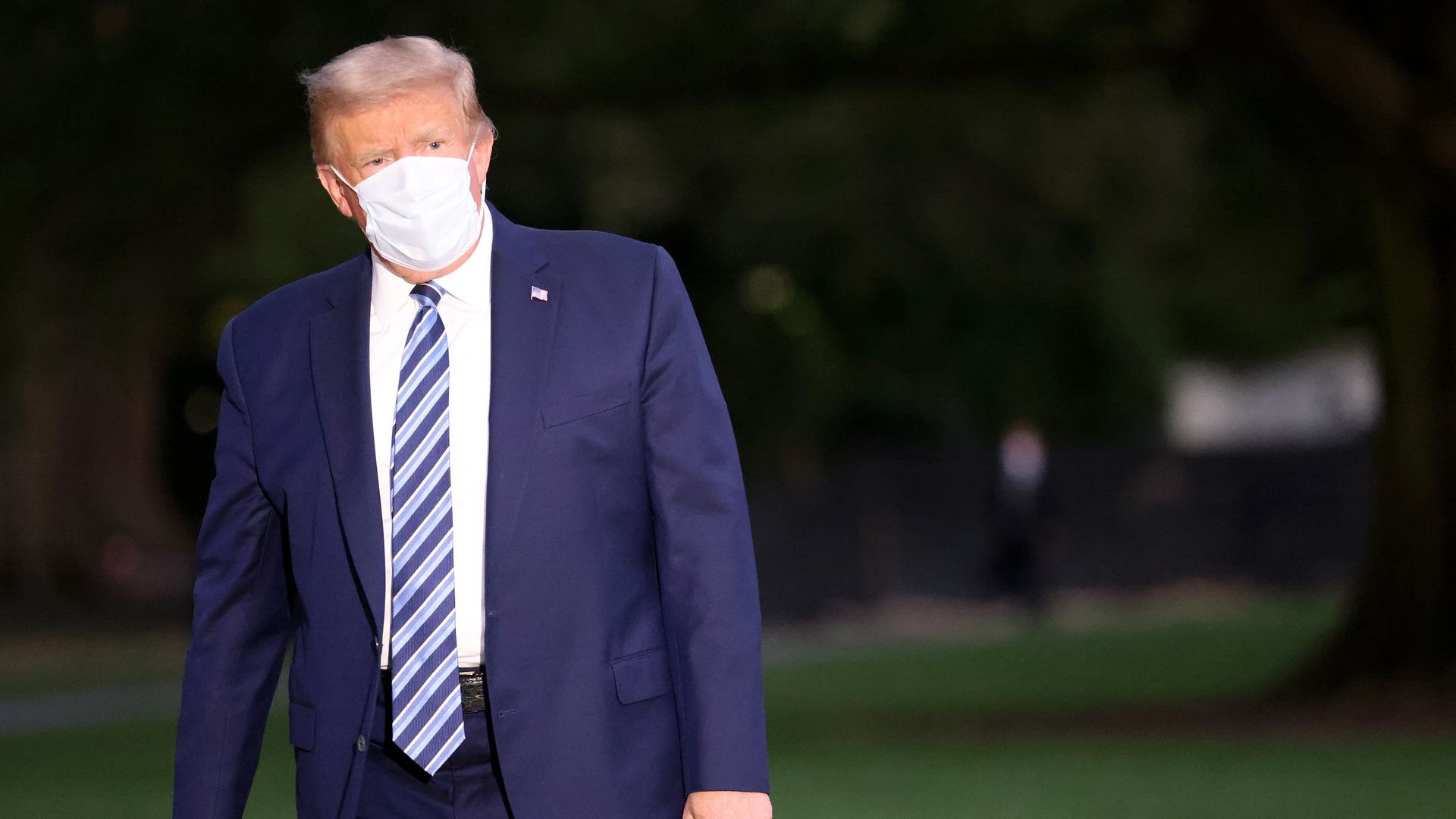 U.S. President Donald Trump returns to the White House from Walter Reed National Military Medical Center wearing a mask