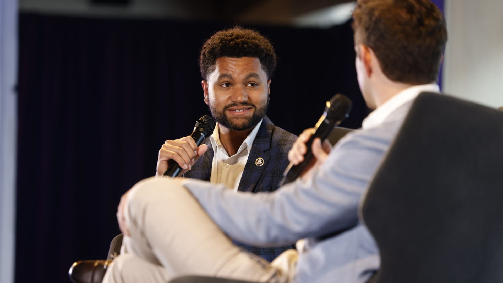 Rep. Frost on stage in conversation with Axios' Alex Thompson.