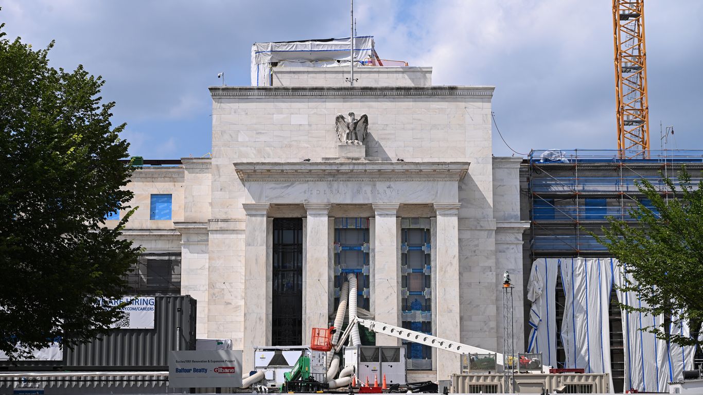Fed leaves interest rates unchanged amid Trump pressure, dissents