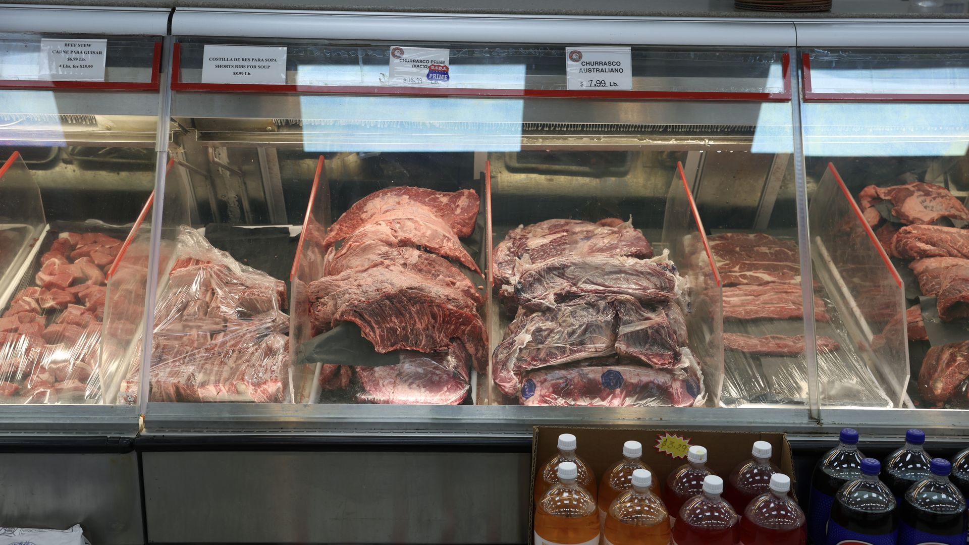 A refrigerator case full of cuts of beef. 