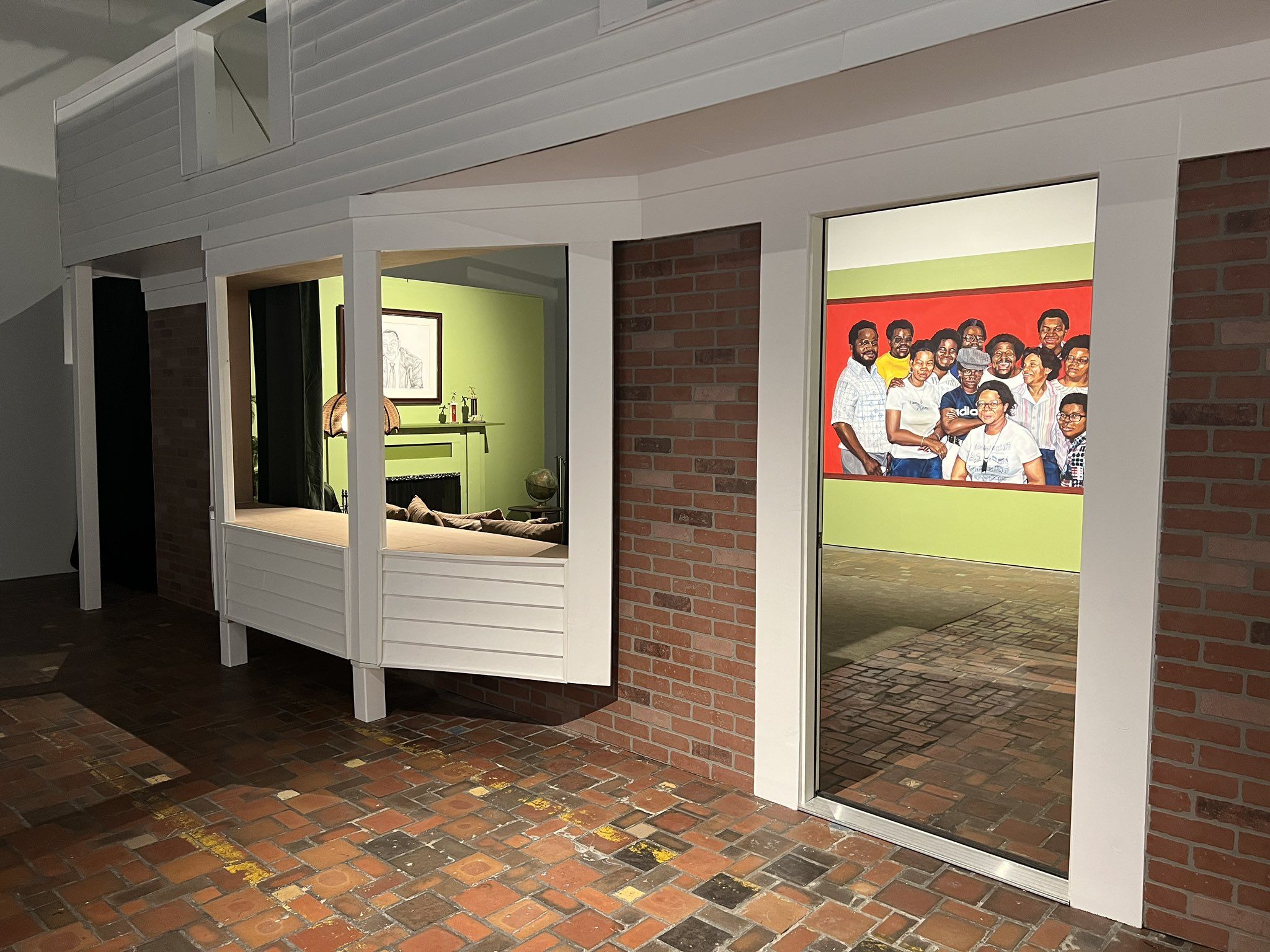 One of the installations inside the exhibition features a living room and family portrait.  