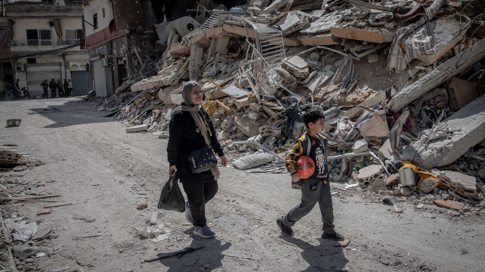 mom and kid in rubble