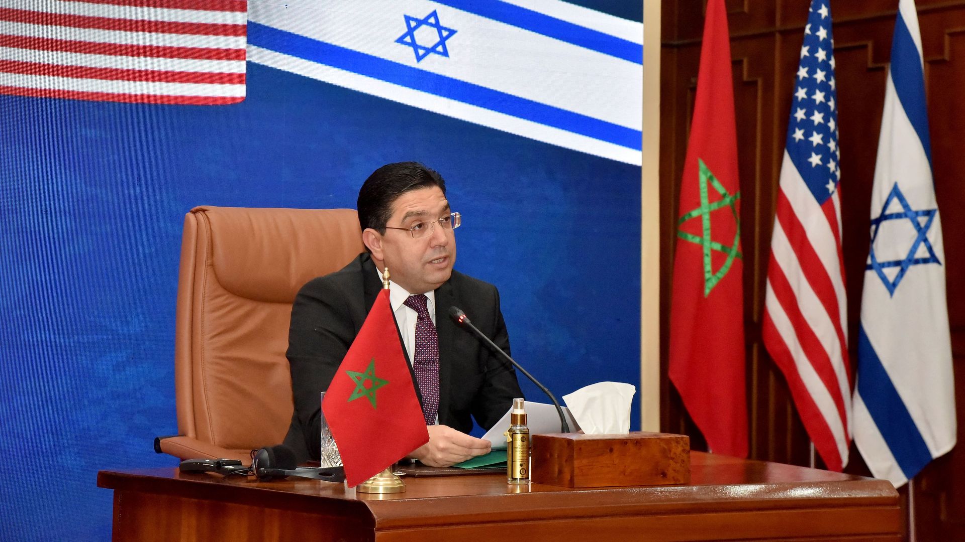 Moroccan Foreign Minister Nasser Bourita, takes part in a virtual meeting with his US and Israeli counterparts, in his office in the capital Rabat, on December 22, 2021