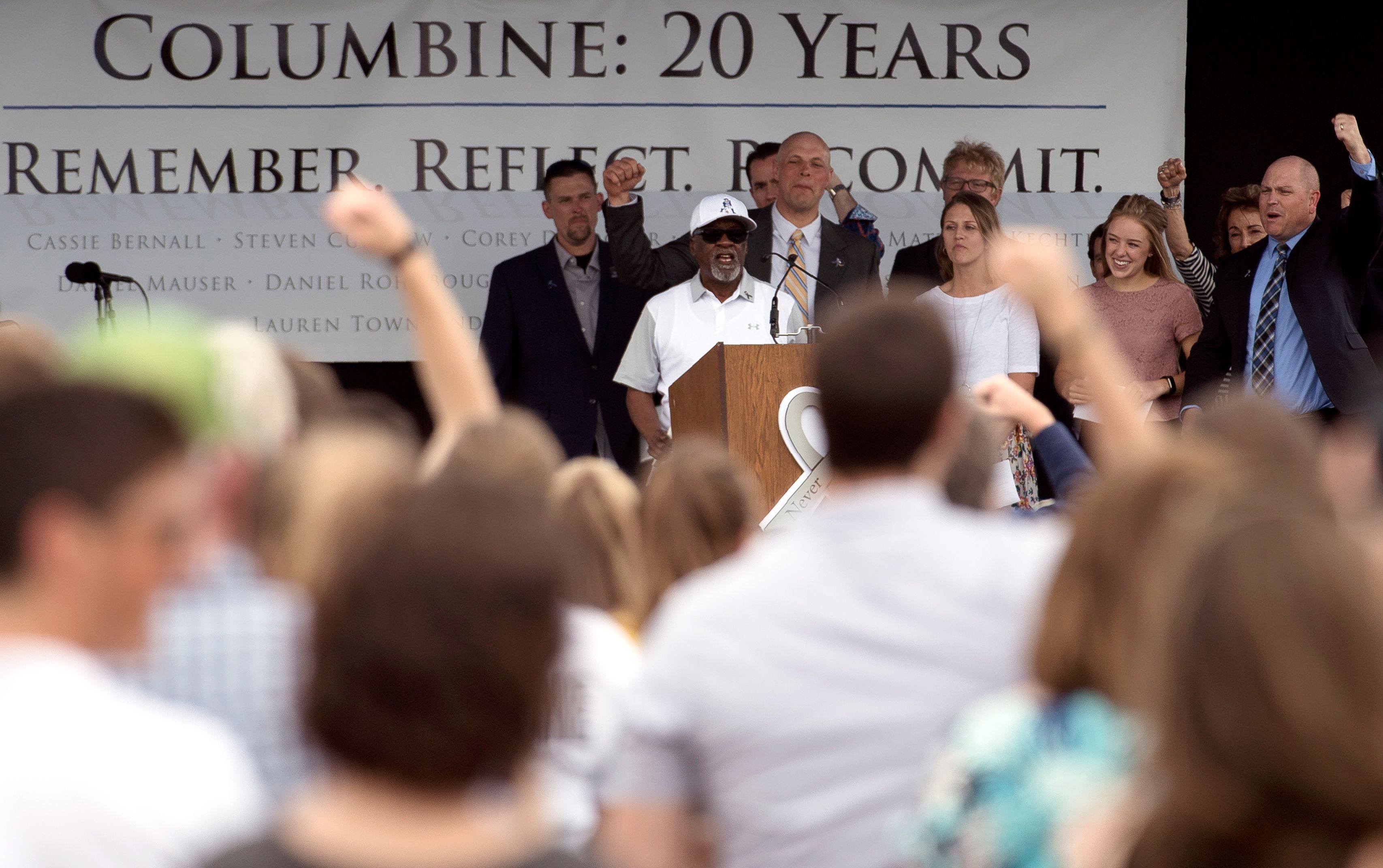  Columbine High School teacher Ivory Moore (C) rallies up community members during the Columbine Remembrance Ceremony.
