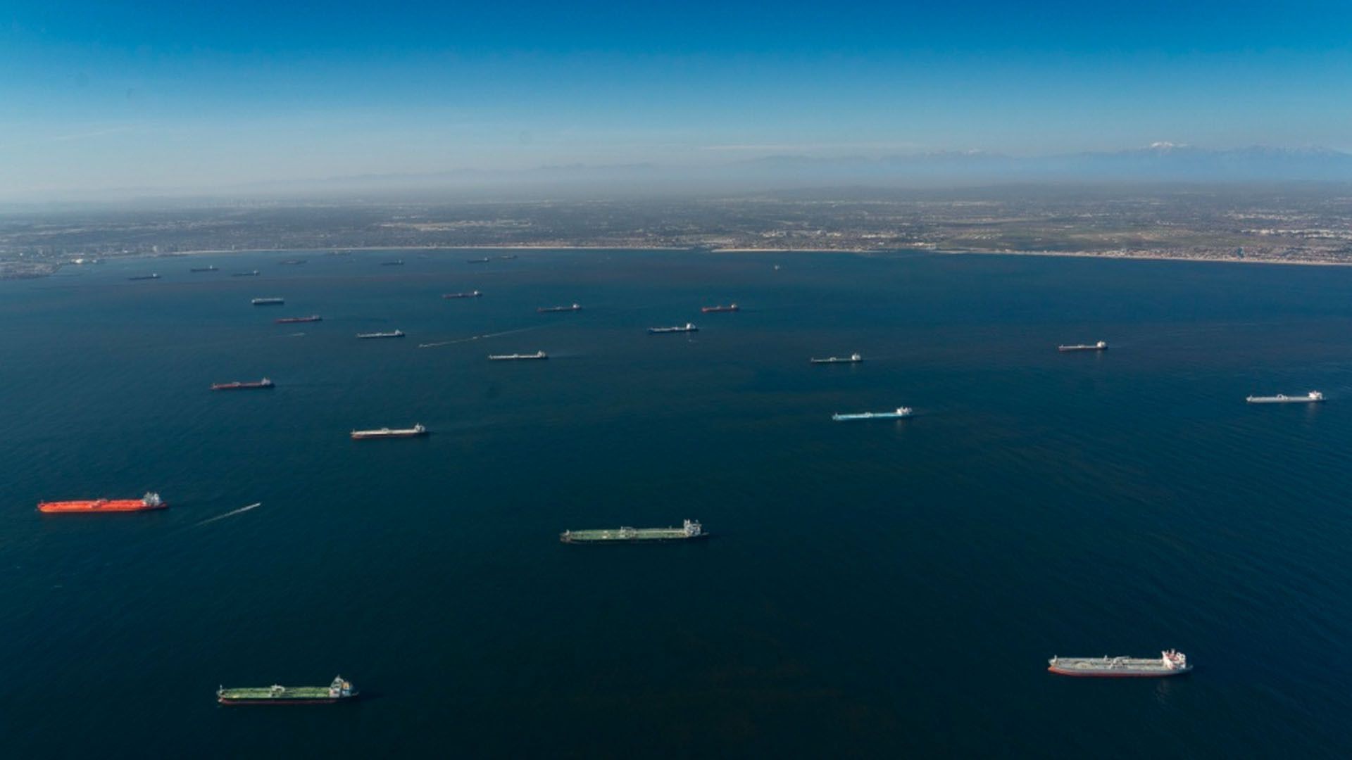 Oil tankers parked in the ocean.