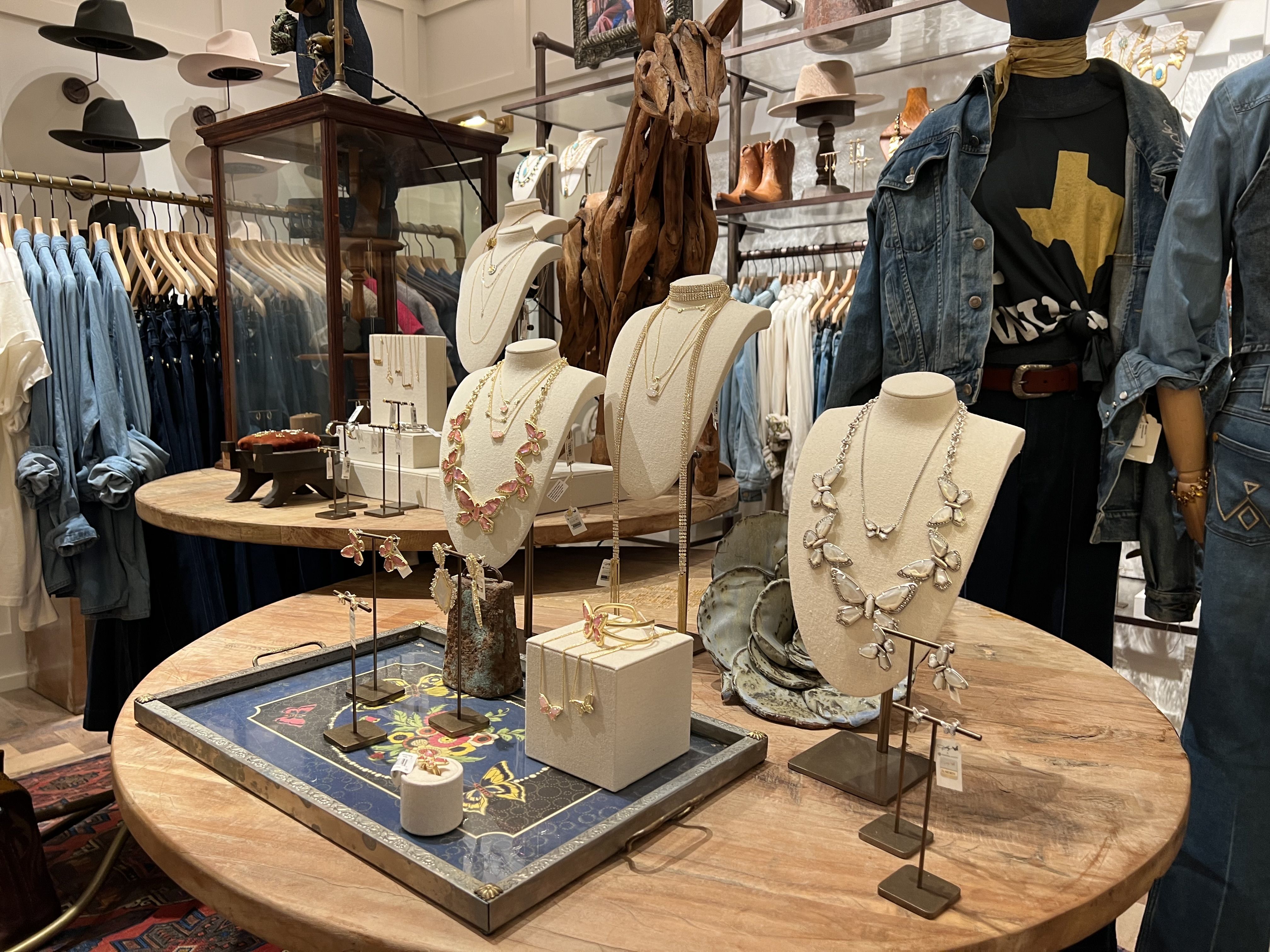 A photo of Dolly Parton necklaces at Kendra Scott's Yellow Rose.