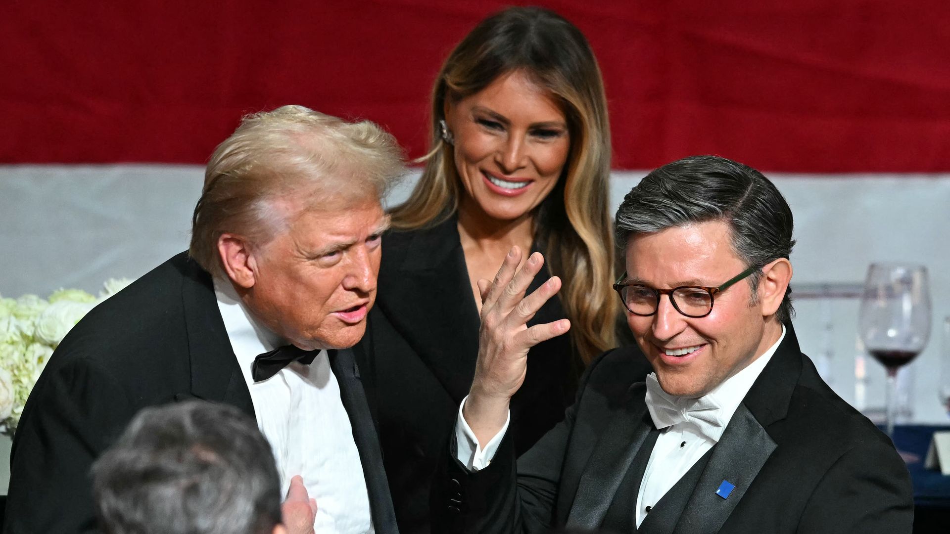 Former US President and Republican presidential candidate Donald Trump (L) chats wih US Speaker of the House Mike Johnson (R) alongside former US First Lady Melania Trump during the 79th Annual Alfred E. Smith Memorial Foundation Dinner at the Hilton Midtown in New York, October 17, 2024. (Photo by 