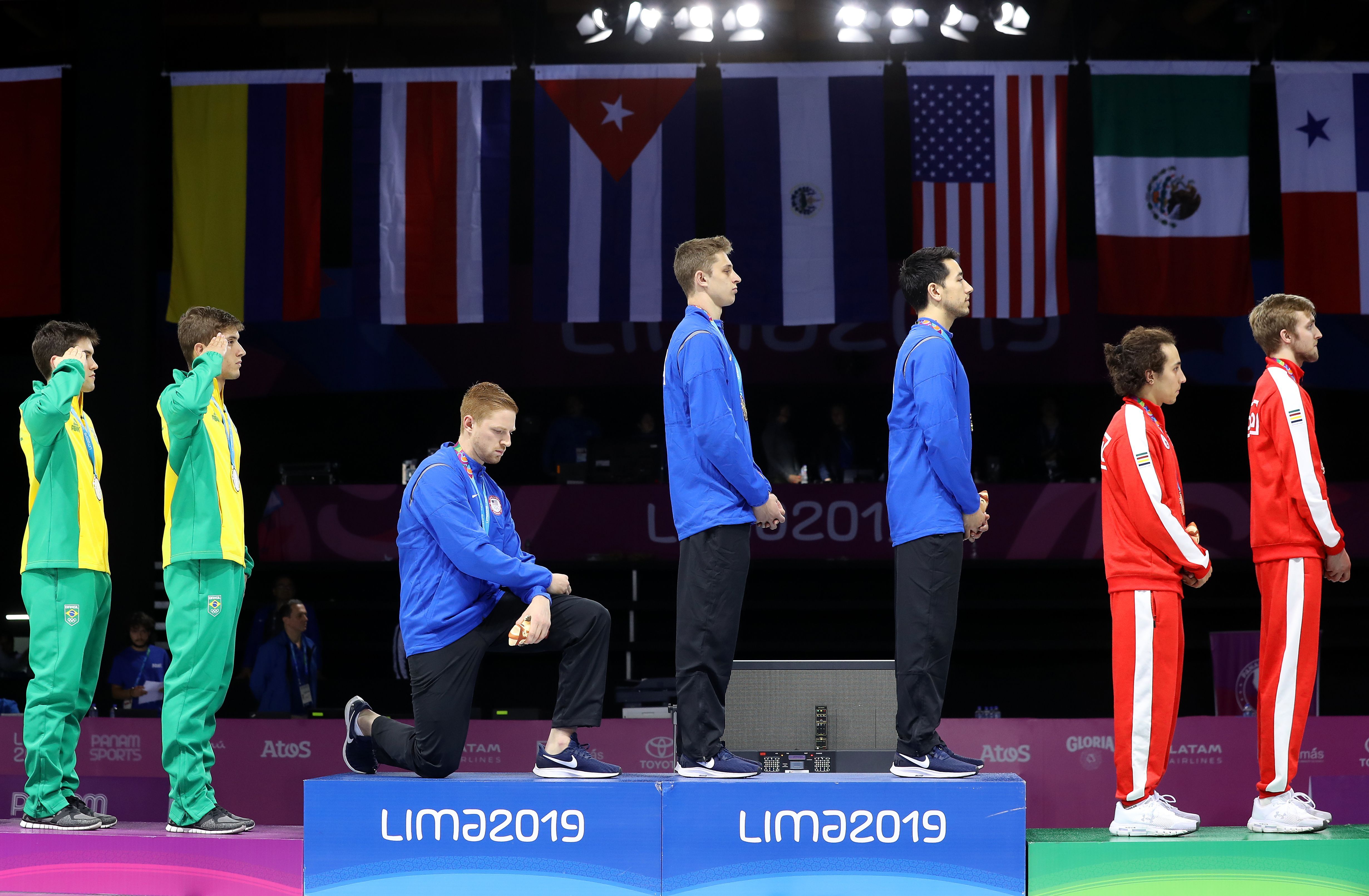 Olympians kneeling