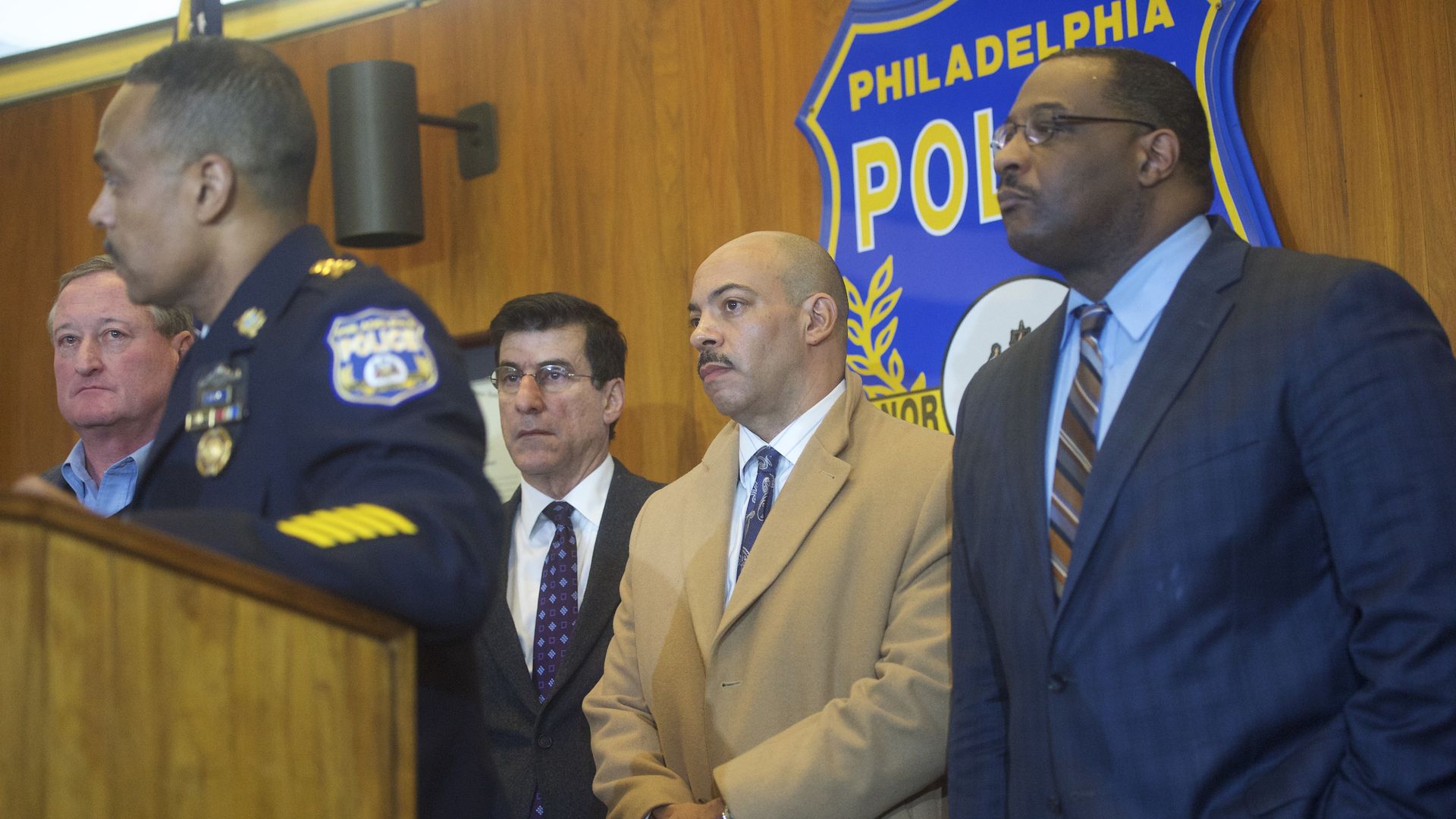 Former Philadelphia District Attorney Seth Williams, middle,  with police officials at a news conference. 