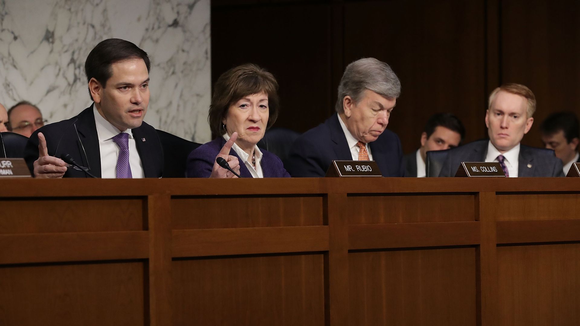 Senate Intelligence Committee members Marco Rubio, Susan Collins and others preside over a hearing.