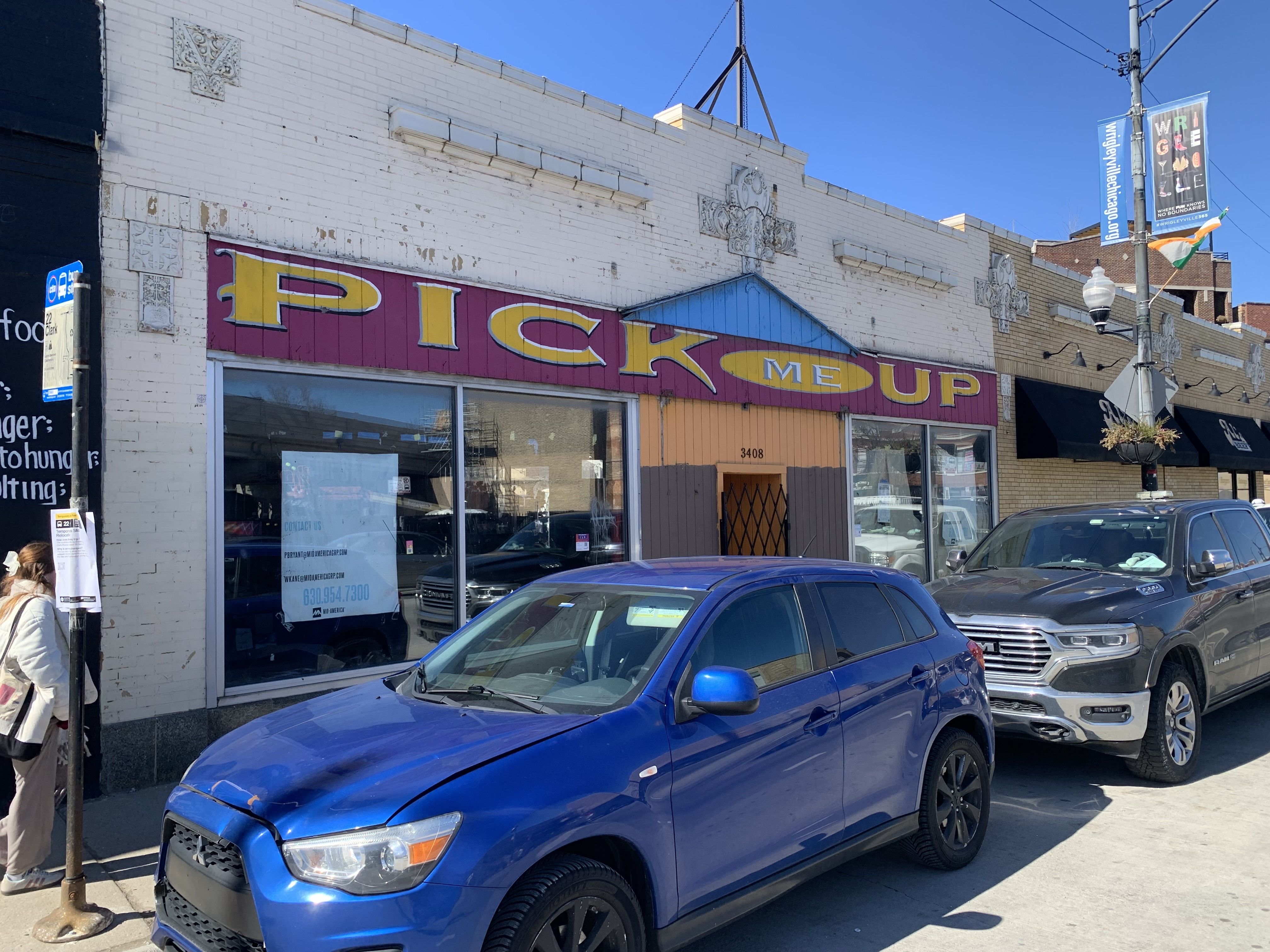 Photo of a storefront that says "Pick Me Up"