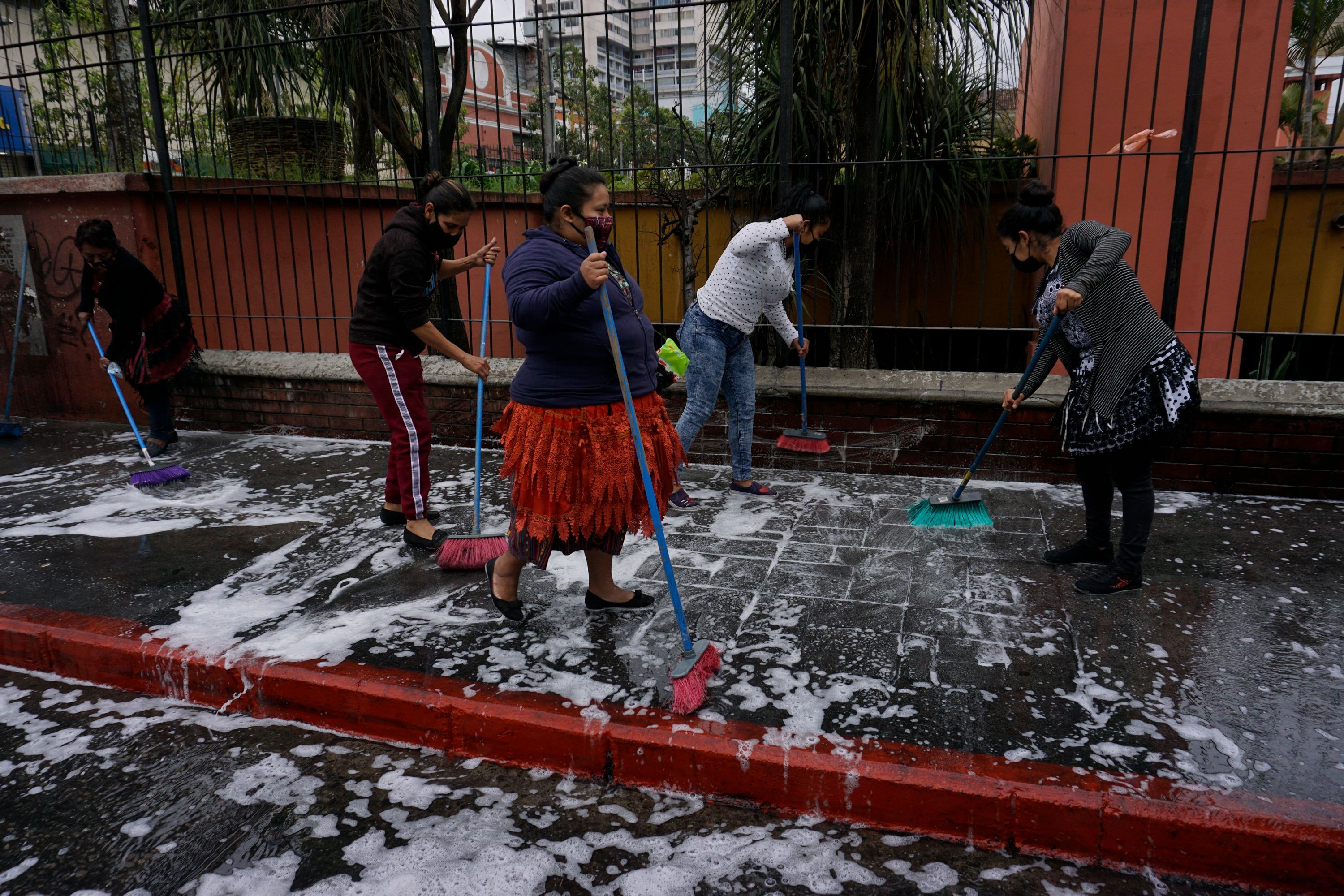 Sellers at the Central market disinfect the place as a preventive measure against the spread of COVID-19, in Guatemala City, on March 9
