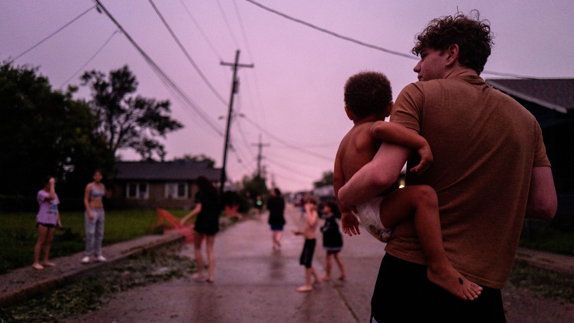 Image shows people playing in the street