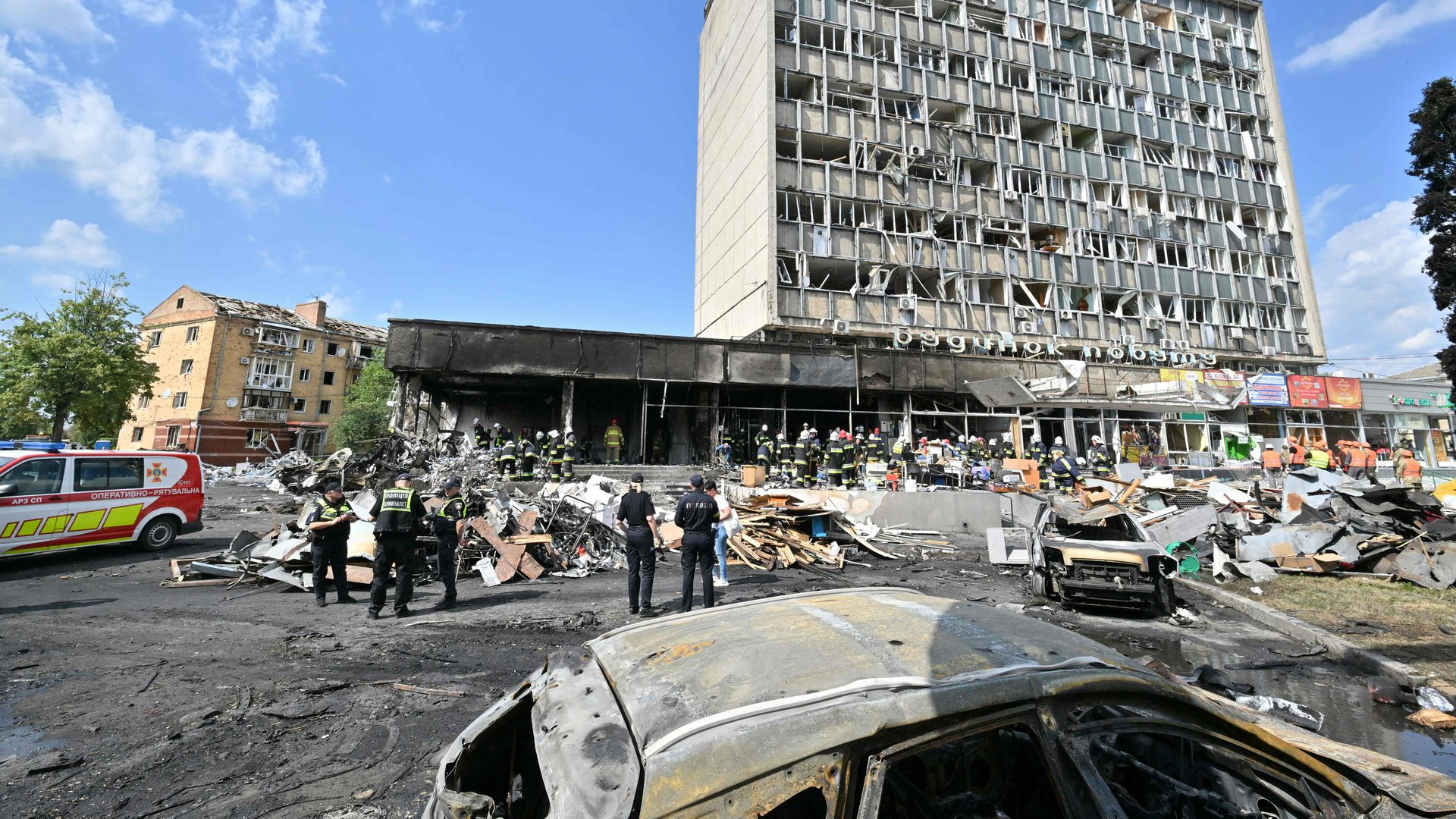 Firefighters inspect a damaged building following a Russian airstrike in the city of Vinnytsia, west-central Ukraine on July 14.