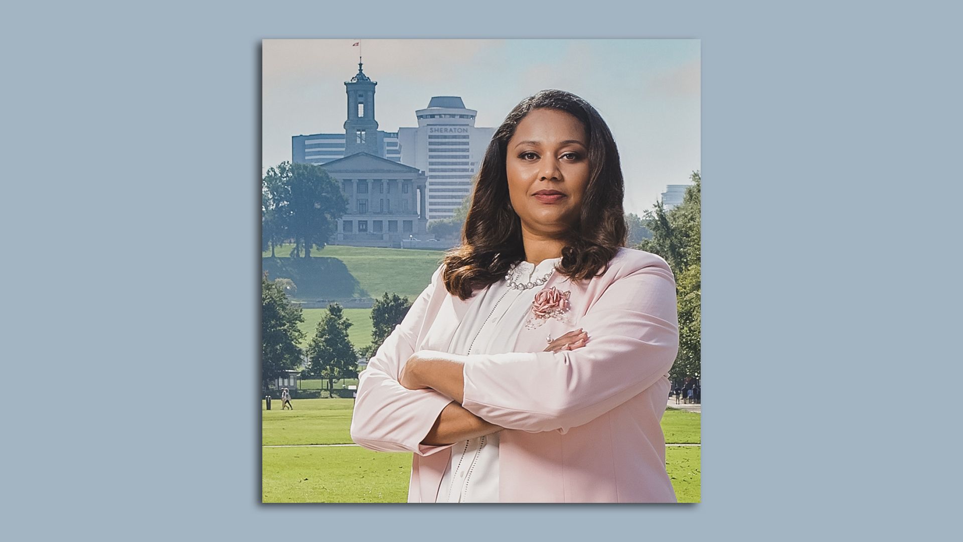 headshot of woman standing in front of capital
