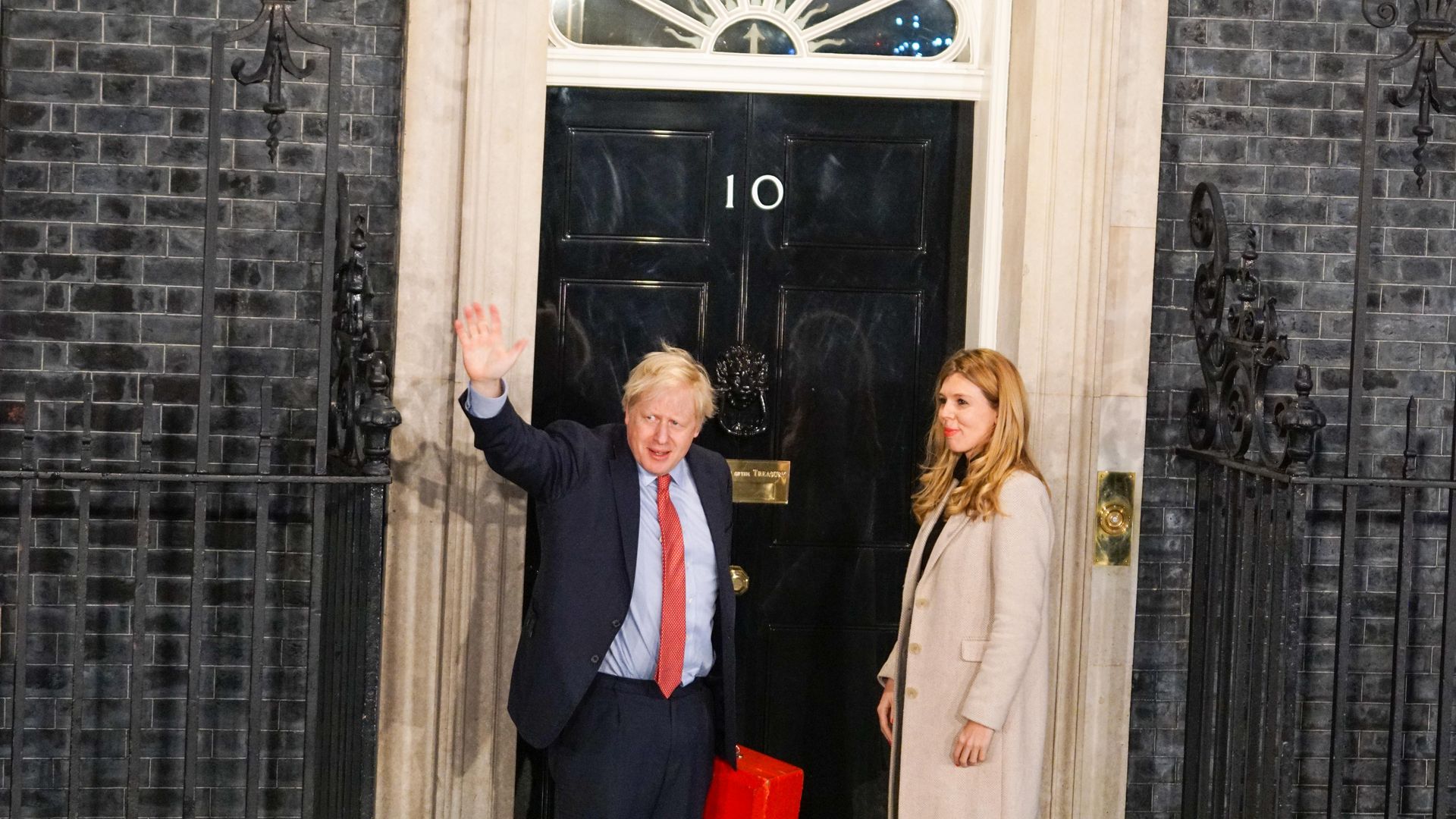 Prime Minister Boris Johnson and his partner Carrie Symonds enter Downing Street as the Conservatives celebrate a sweeping election victory on December 13, 2019 in London