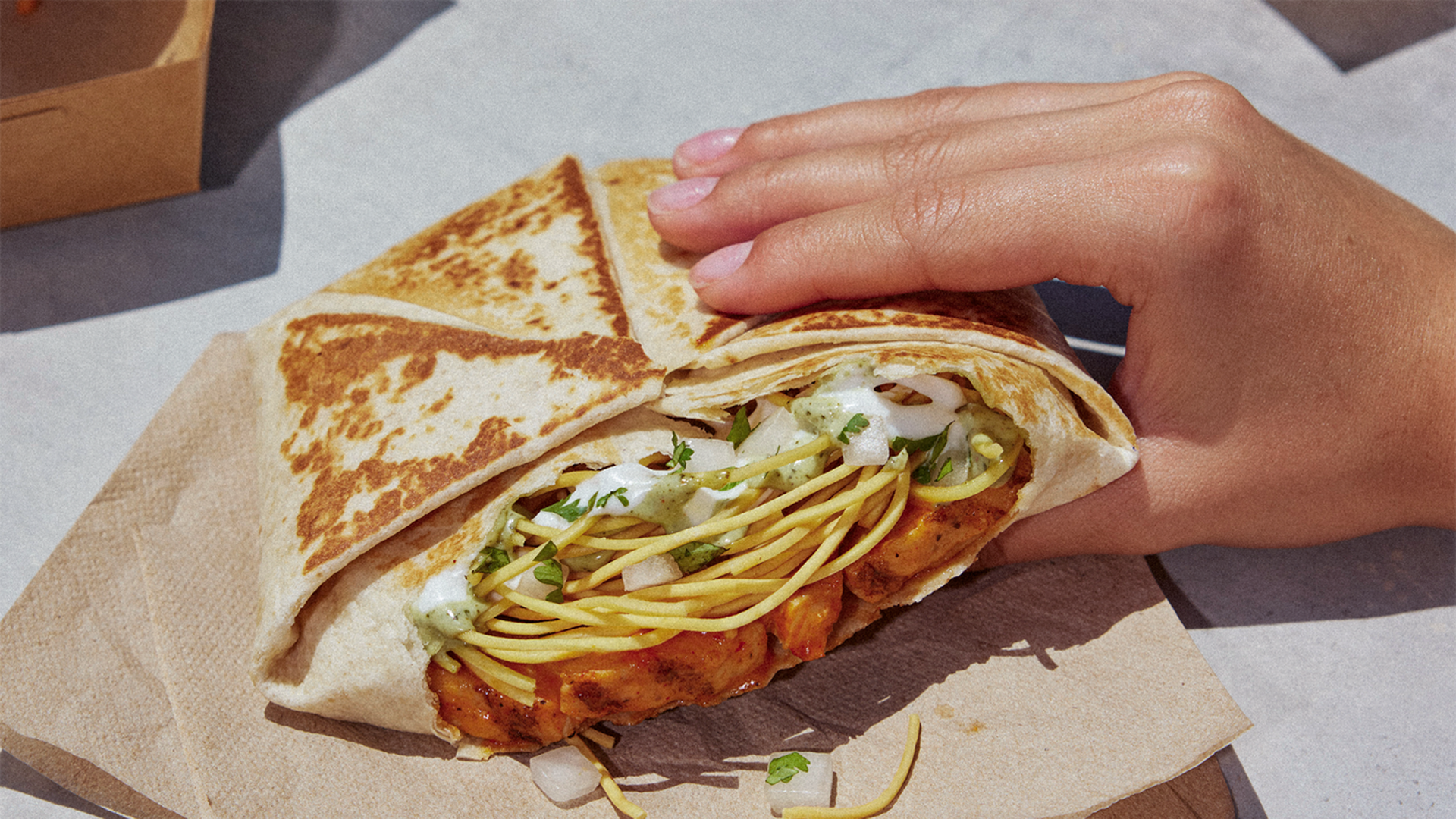 A Crunchwrap Supreme with crunchy Thai noodles.