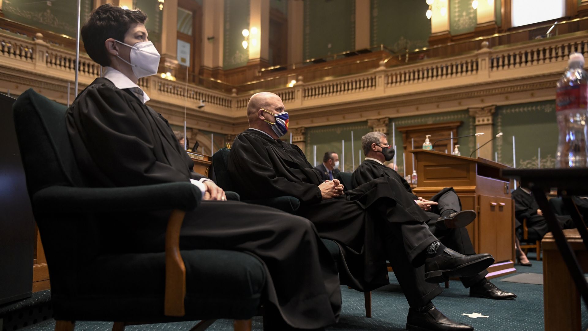 Justices Monica M. Márquez, William W. Hood, III and Richard L. Gabriel of the Colorado Supreme Court. 