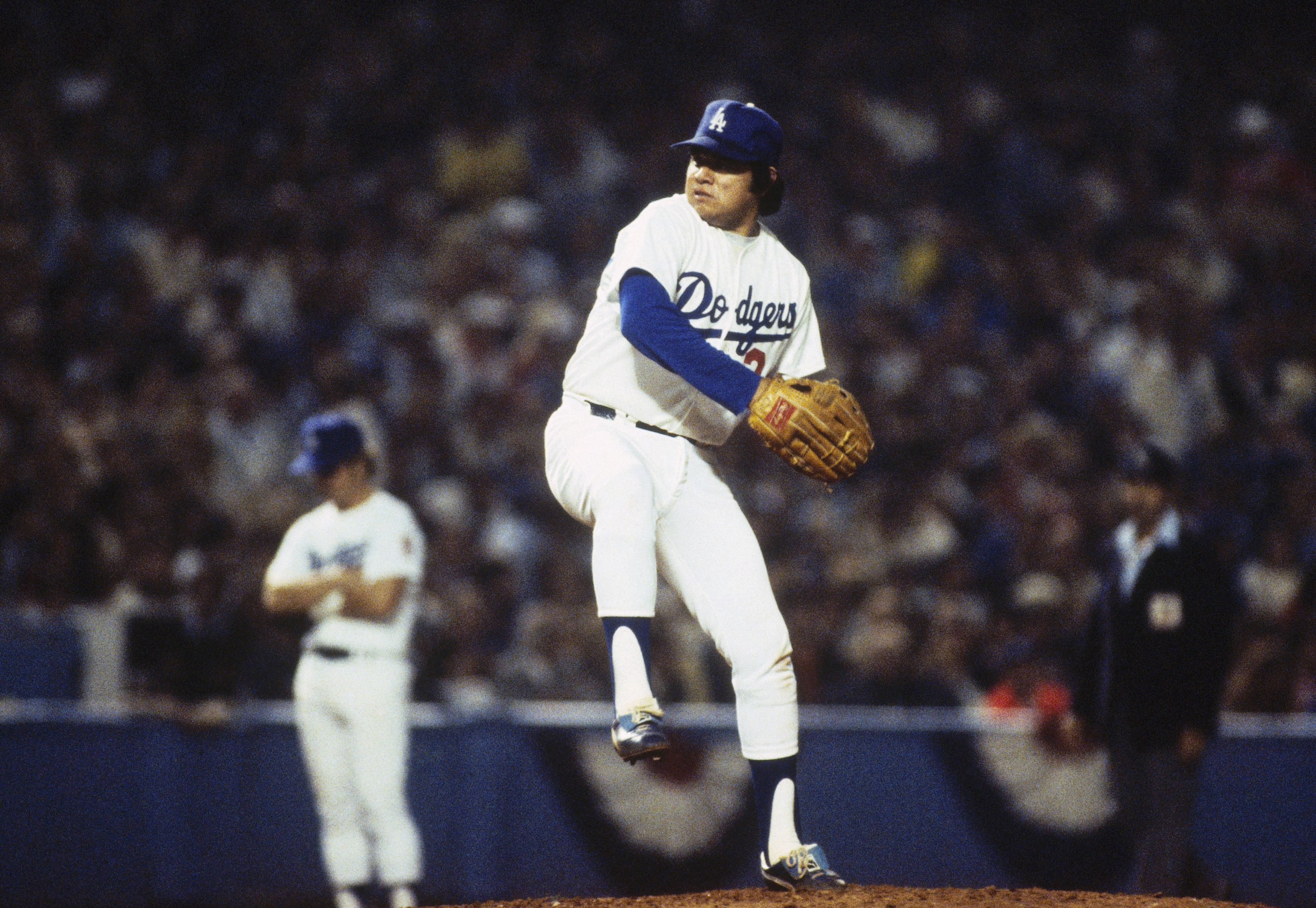 Fernando Valenzuela #34 of the Los Angeles Dodgers pitches against the New York Yankees during Game 3 of the 1981 World Series at Dodger Stadium on October 23, 1981, in Los Angeles.