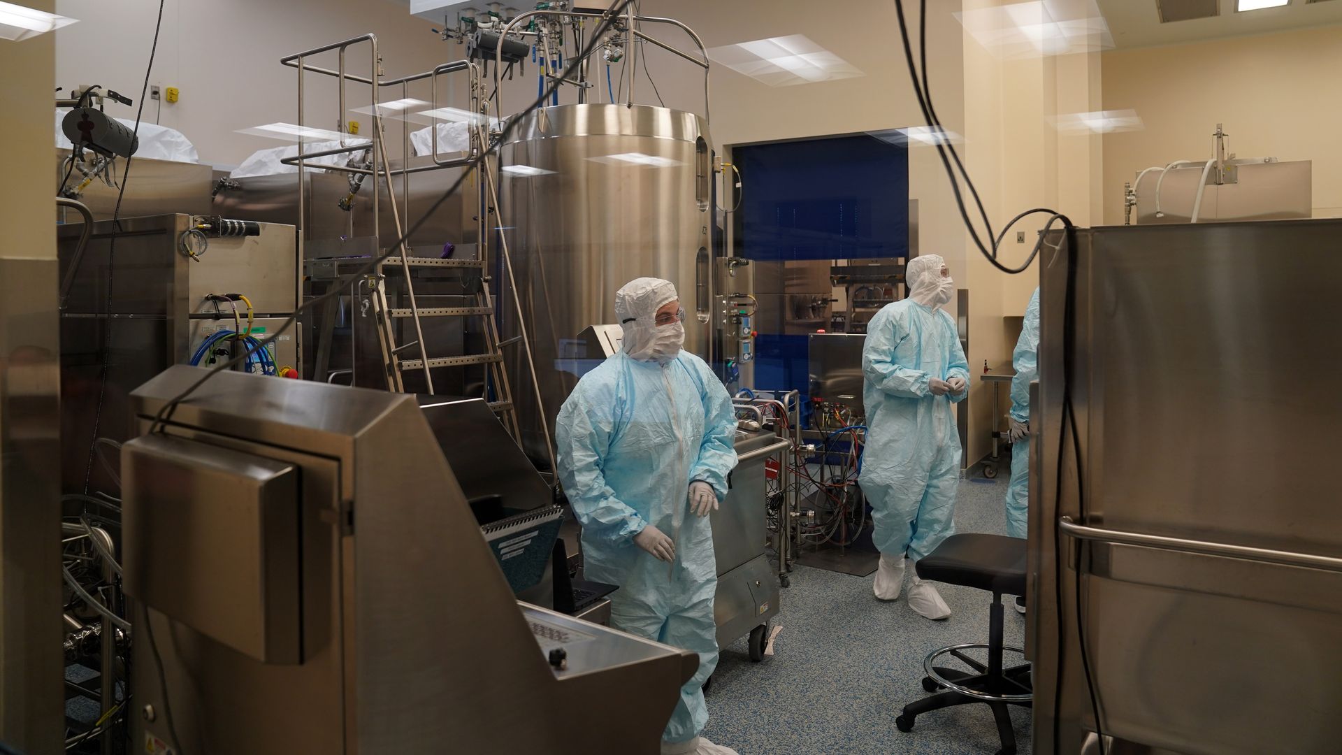 8 Employees work in a lab at Emergent Biosolutions, which is manufacturing vaccines for AstraZeneca and Johnson & Johnson on February 8, 2021 in Baltimore, Maryland.