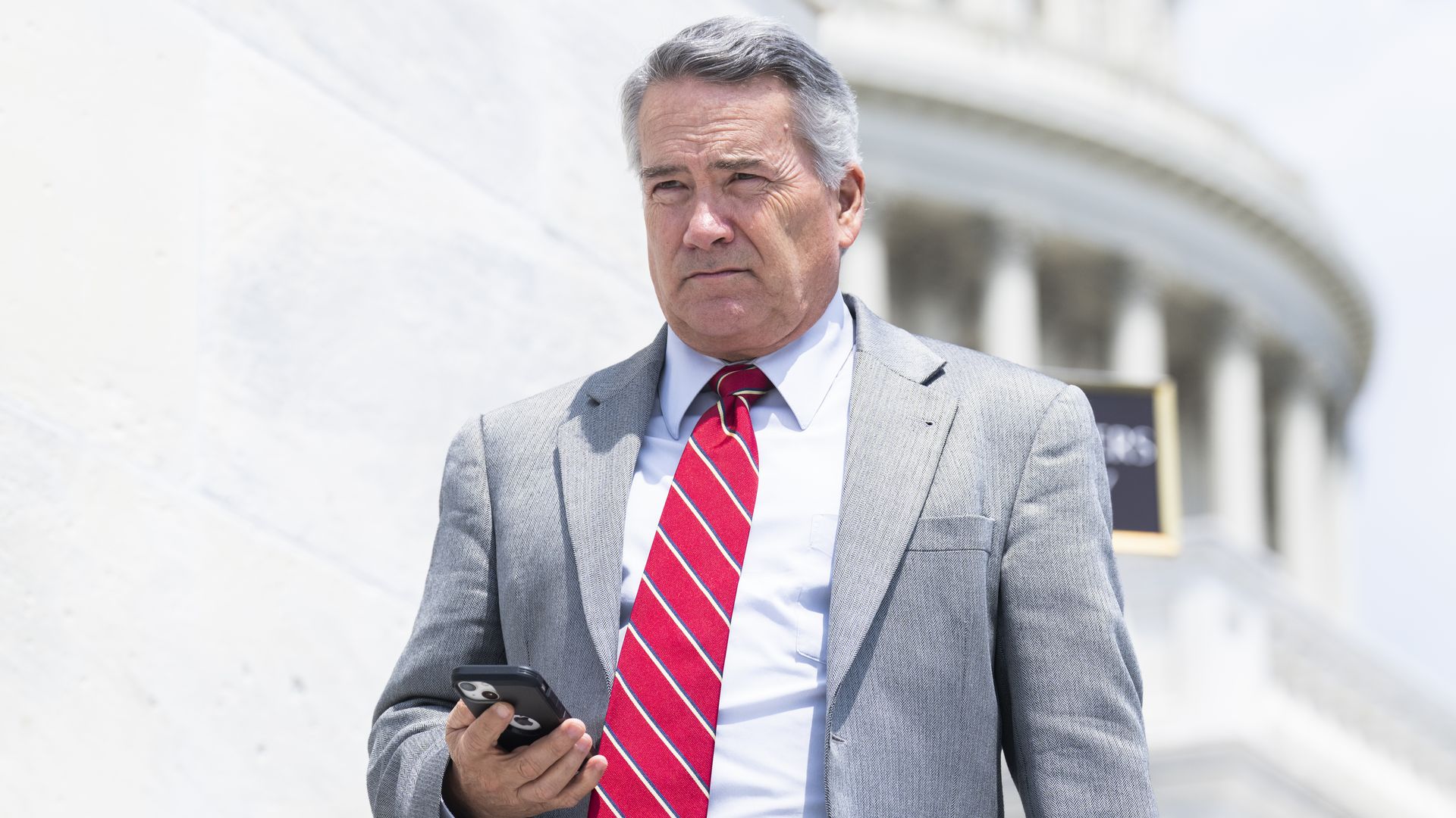 Rep. Jody Hice holding a cell phone