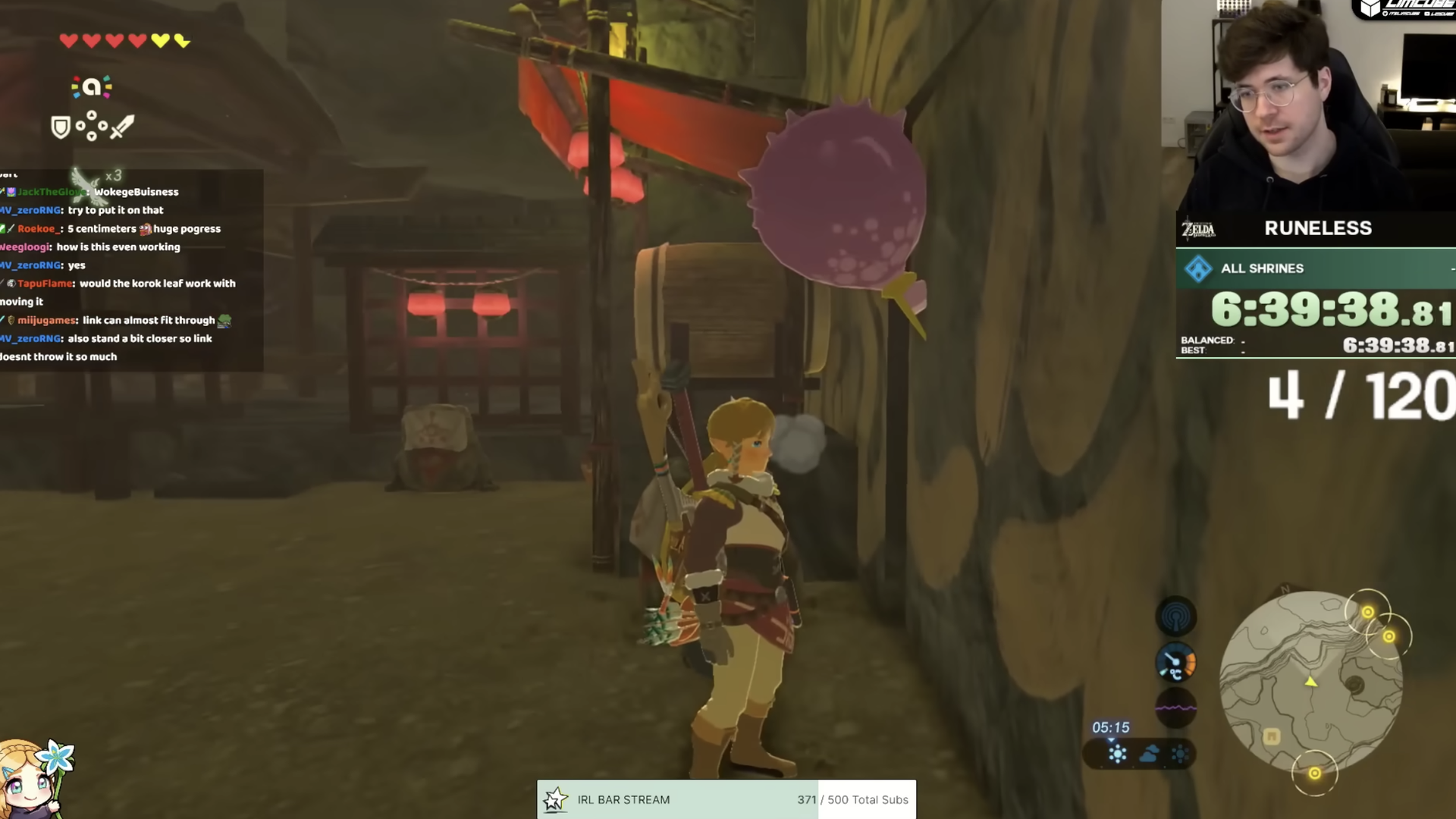 Video game screenshot showing a character standing at a door during a speedrun. An inset of the person playing the game appears in the upper right as a timer ticks up