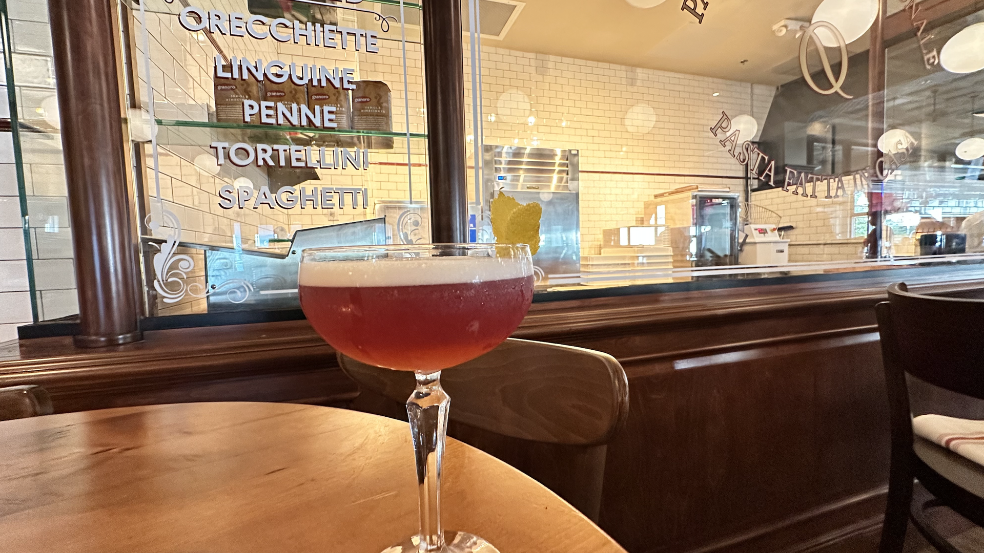 A cocktail on a wooden table