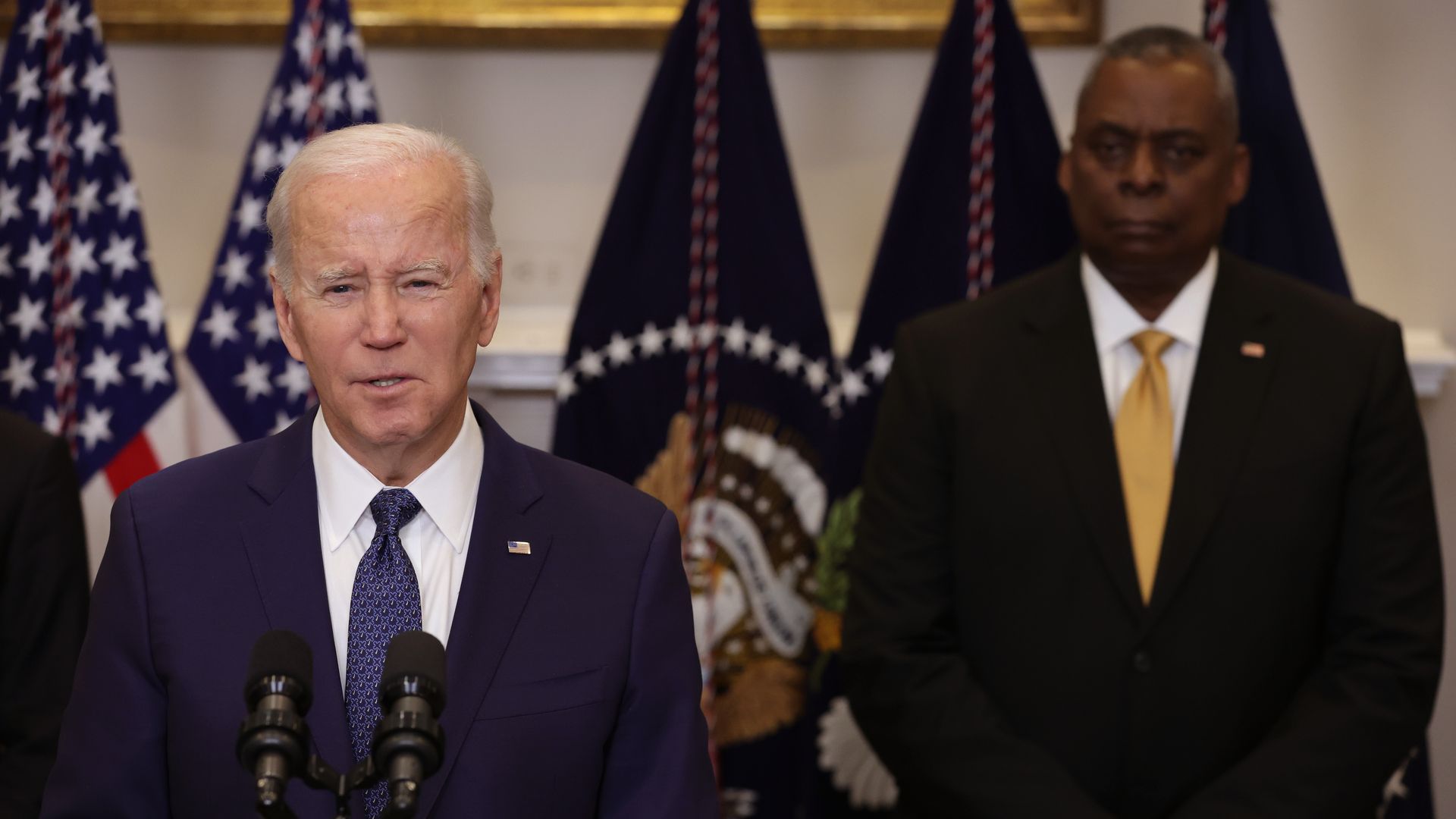 President Joe Biden makes an announcement on additional military support for Ukraine as Secretary of Defense Lloyd Austin (R) listens in the Roosevelt Room of the White House on January 25.