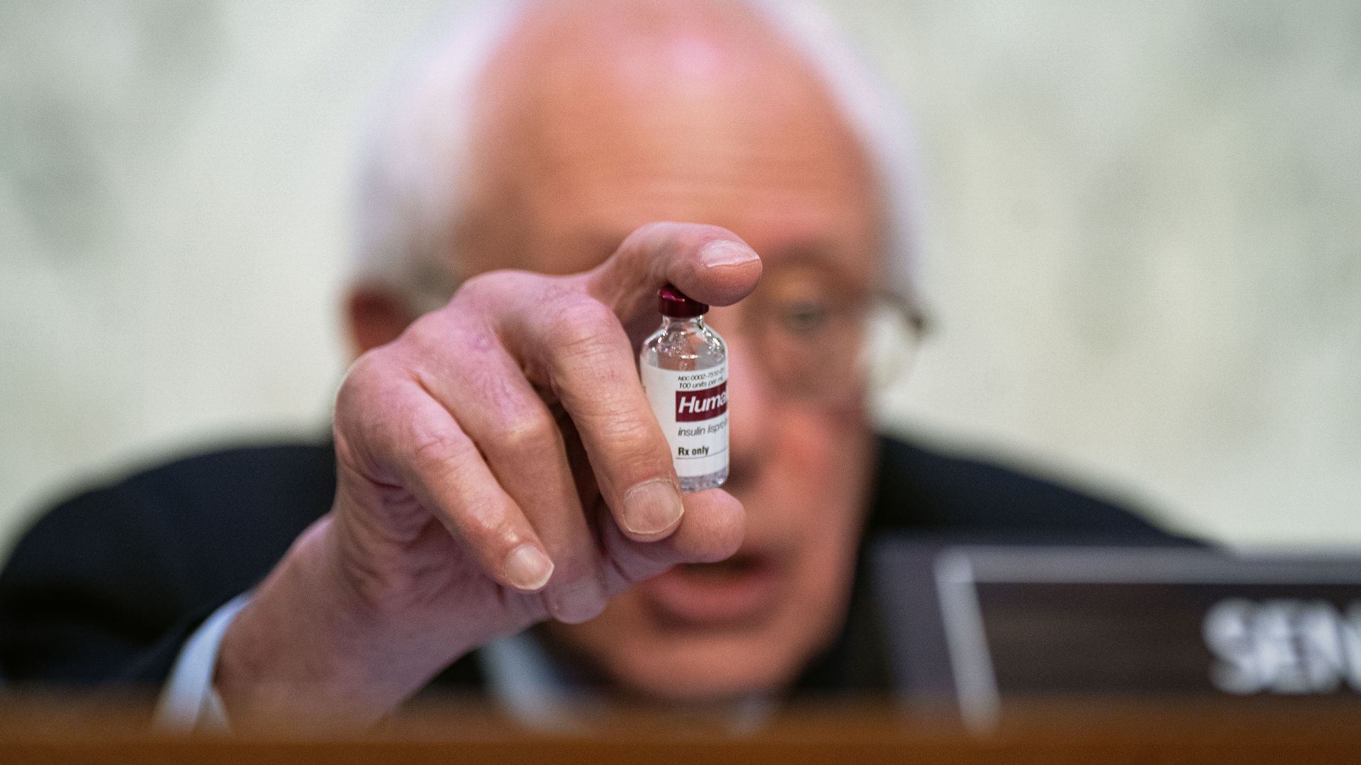 Senator Bernie Sanders, an Independent from Vermont and chairman of the Senate Health, Education, Labor, and Pensions Committee, holds a vial of insulin medicine during a hearing on Wednesday, May 10.