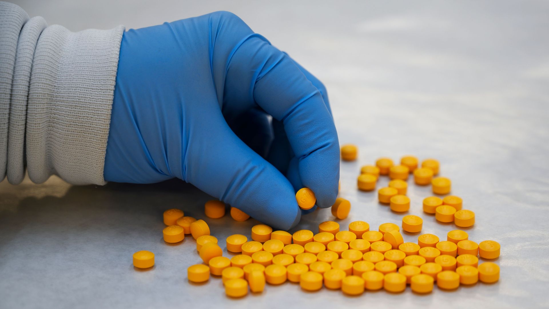 A Drug Enforcement Administration chemist handling a powder containing fentanyl in 2019.