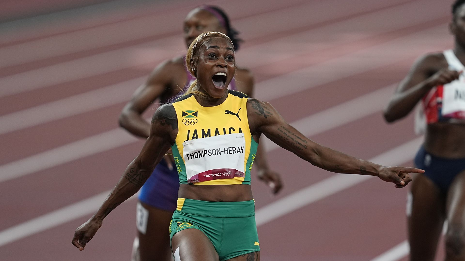 Elaine Thompson-Herah wins the gold in 100 meter for women in 9.61 , Olympic record, at the Tokyo Olympics,